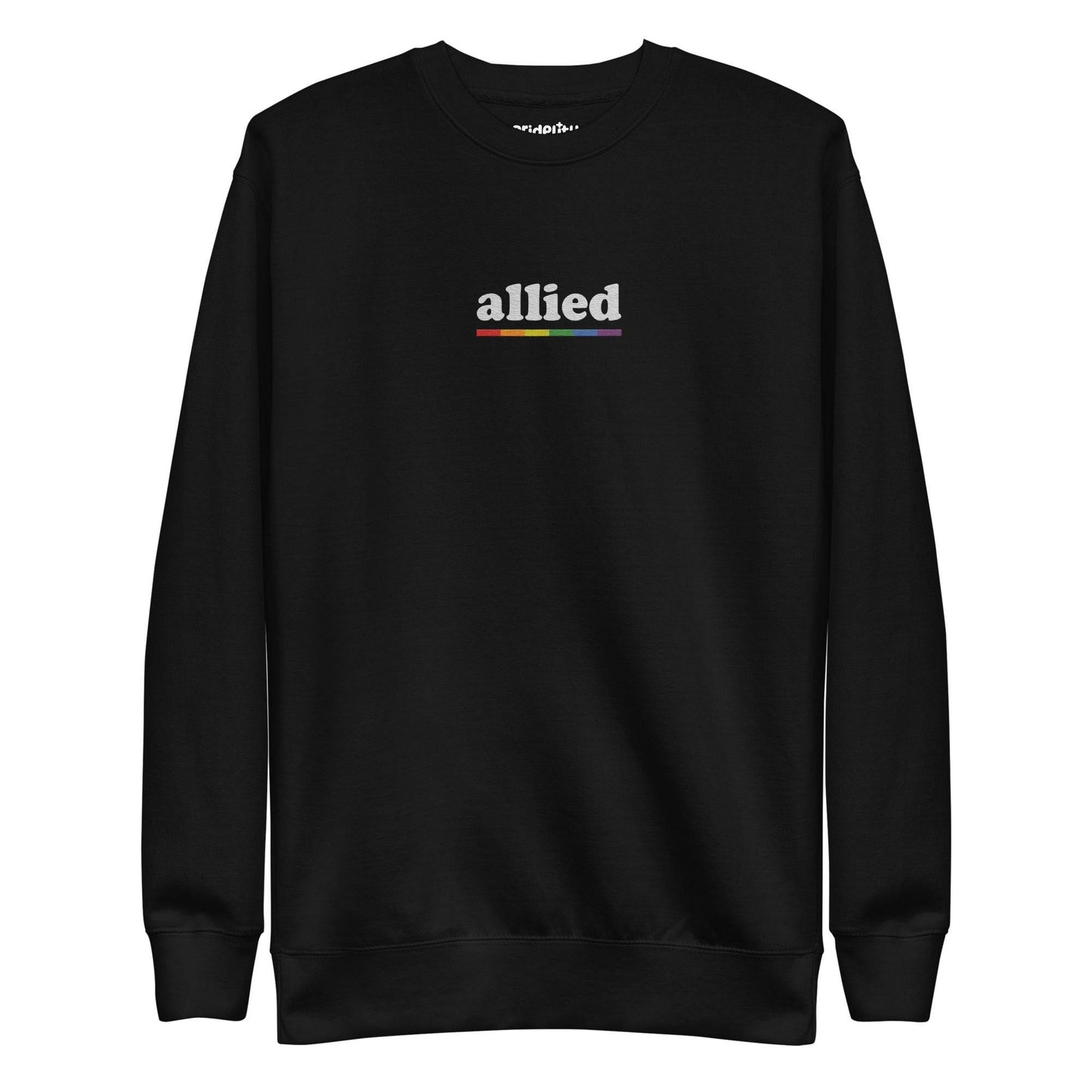 This Allied Sweatshirt by Pridelity, from our Pride Collection, showcases the word "allied" in lowercase letters. Beneath it is a multi-colored horizontal line in shades of gray, blue, yellow, black, and red to honor diversity. The look is finished with a classic crew neck for timeless style.