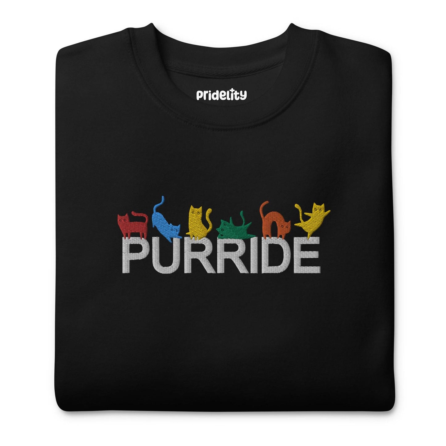 The Purride Sweatshirt by Pridelity is a black sweatshirt from the pride collection, showcasing the word "PURRIDE" across the chest. Above this, colorful silhouettes of cats in playful poses represent every shade of the rainbow.
