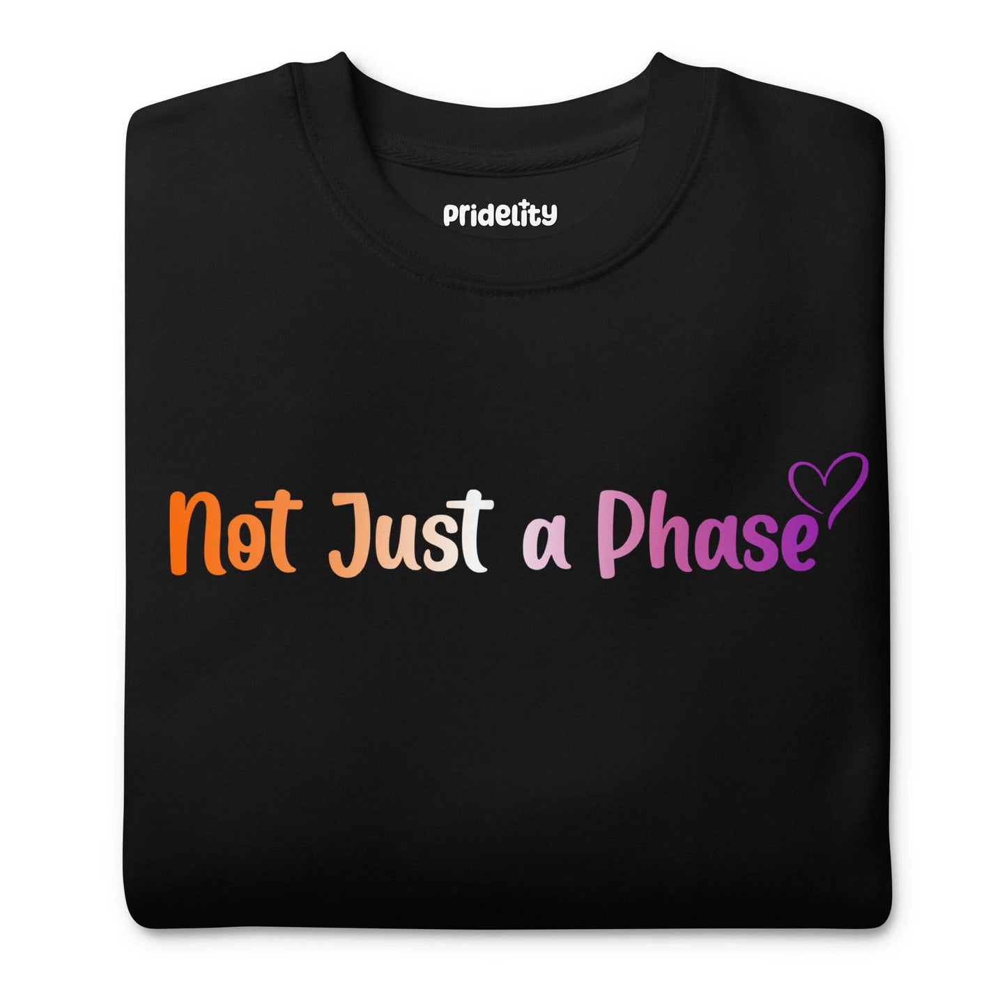 The black Not Just A Phase Sweatshirt by Pridelity, featuring rainbow text that reads "Not Just a Phase" and accented with a small purple heart on the right side, is a standout piece in any pride outfit.