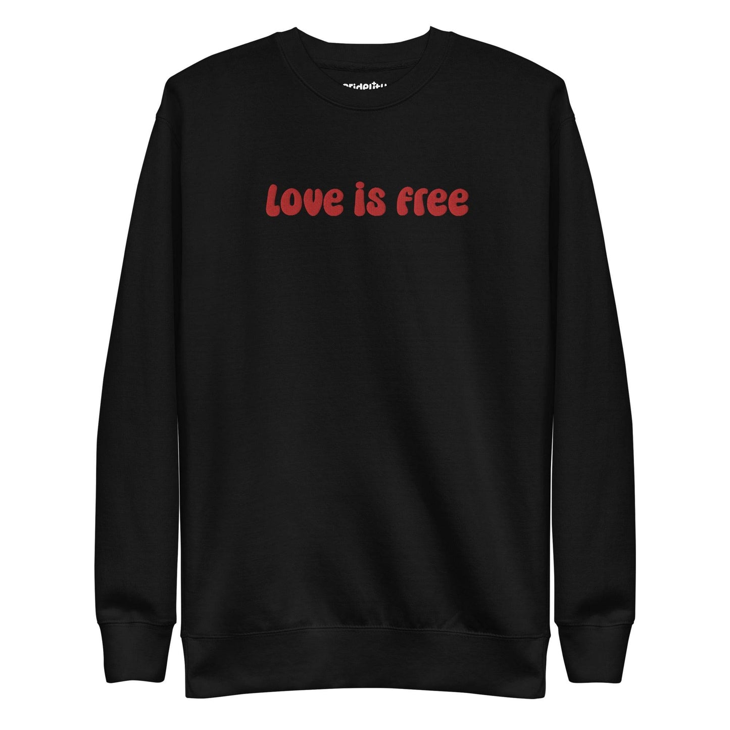 The Love Is Free Sweatshirt by Pridelity is a white sweatshirt with "love is free" boldly displayed in red letters across the chest, capturing the vibrant and inclusive essence of rainbow clothes.