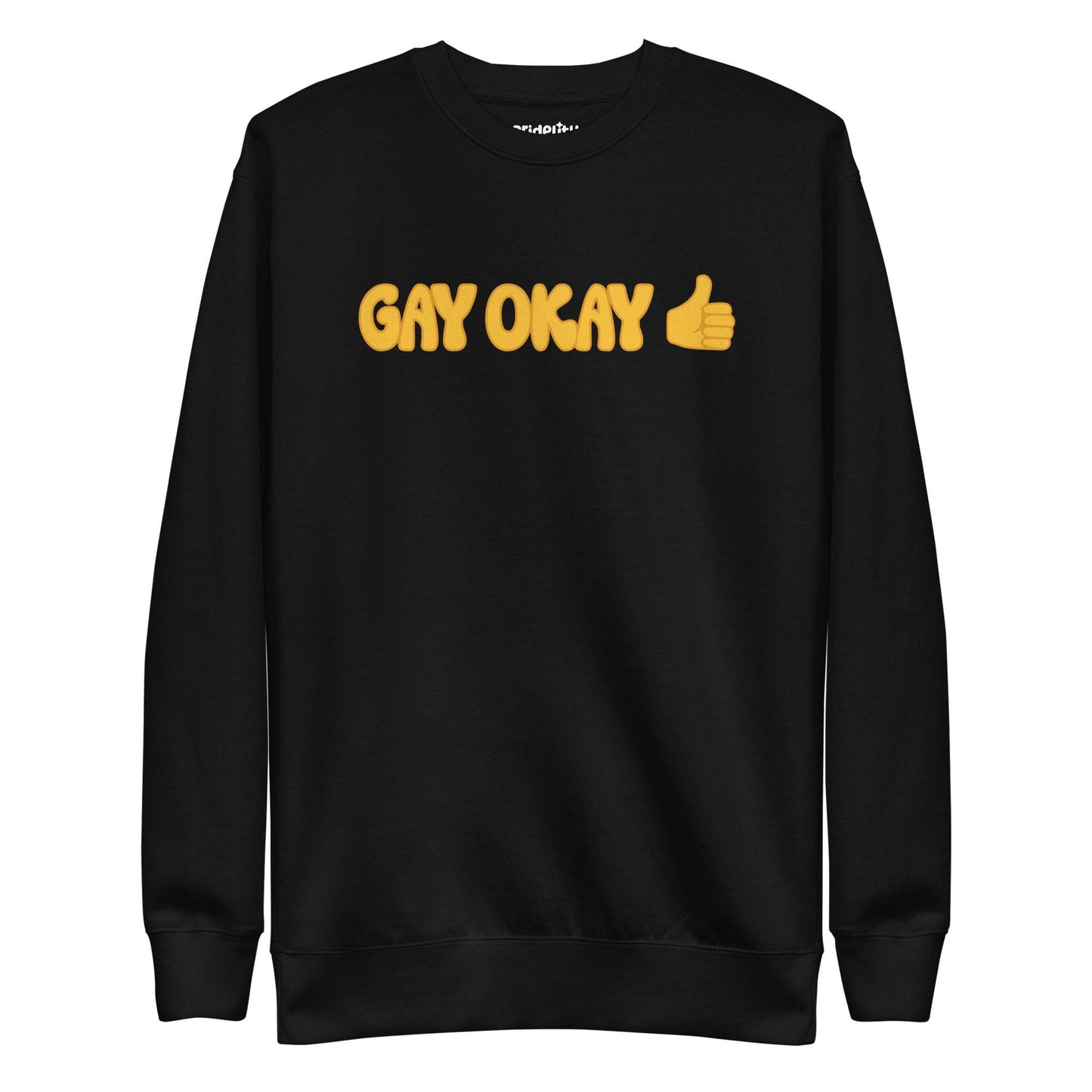 The Pridelity Gay Okay Sweatshirt is a black top adorned with the words "GAY OKAY" in bold yellow lettering and a thumbs-up emoji, offering a stylish way to celebrate pride with its rainbow-themed design.