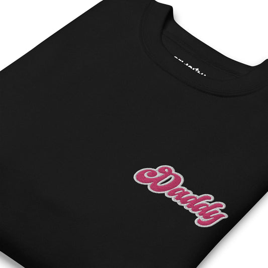 Introducing the "Daddy Sweatshirt" by Pridelity: a sleek black sweatshirt featuring the word "Daddy" beautifully embroidered in pink and white cursive on the left chest area, proudly showcased as part of our Pride Collections.