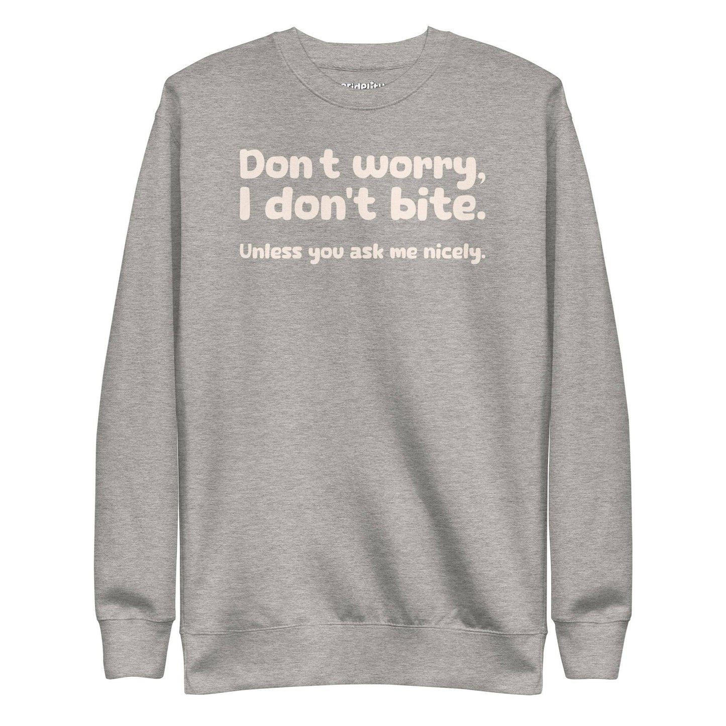 The "I Don't Bite Sweatshirt" by Pridelity, featuring the playful phrase "Don't worry, I don't bite. Unless you ask me nicely" in white text on a Team Royal background, adds a fun twist to your rainbow clothes collection.