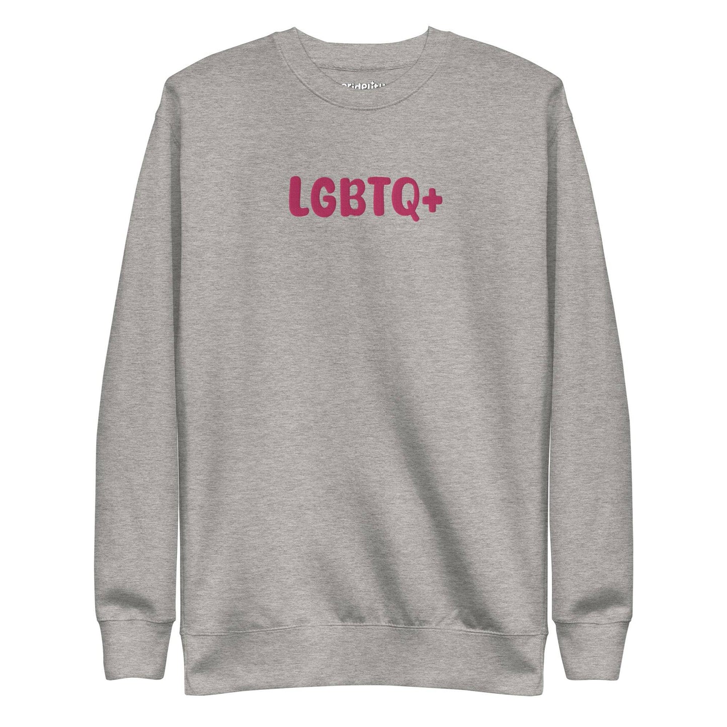 A Pridelity LGBTQ+ Sweatshirt in white, adorned with bold pink "LGBTQ+" lettering on the front, is perfect for embracing your pride with flair and aligns beautifully with the vibrant essence of rainbow apparel.