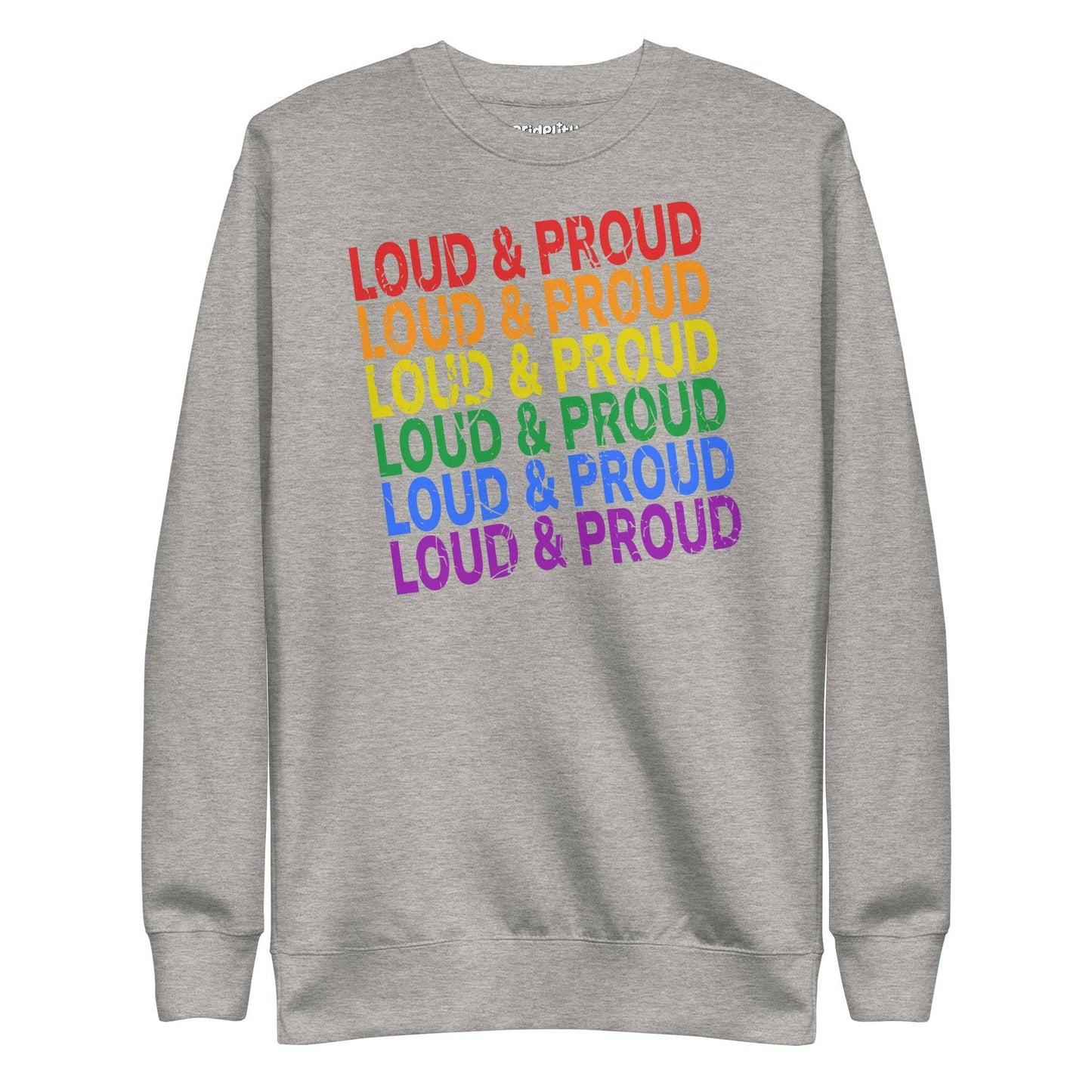 Introducing the Pridelity Loud & Proud Sweatshirt, a white garment adorned with "Loud & Proud" repeated five times in a striking rainbow gradient of red, orange, yellow, green, and blue—ideal for enthusiasts of bold and colorful fashion.