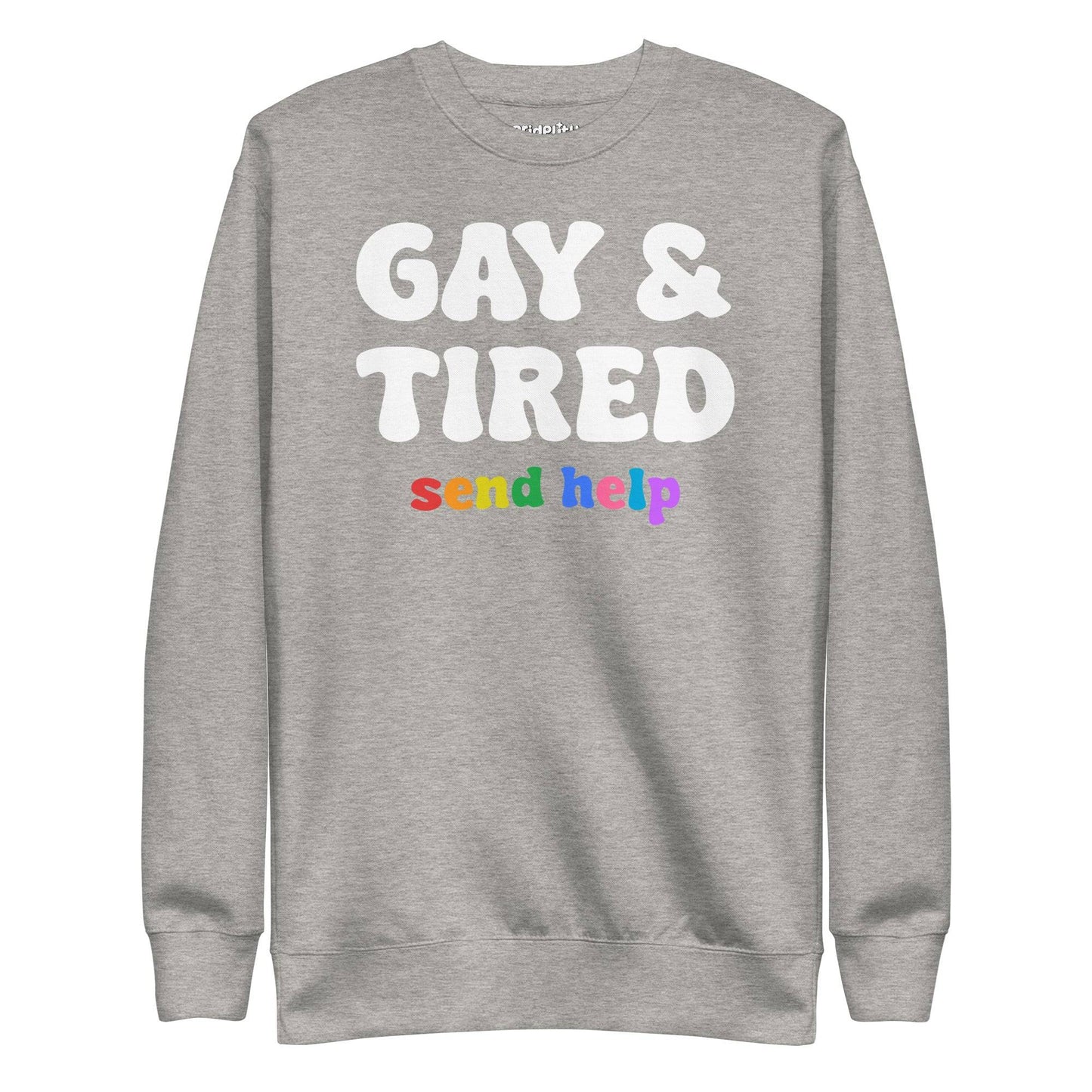 The "Gay & Tired Sweatshirt" by Pridelity is a black sweatshirt that displays bold white text saying "GAY & TIRED" along with colorful, rainbow-hued text below that reads "send help.