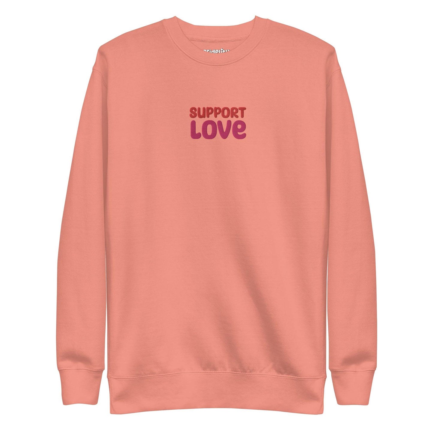 Dusty rose sweatshirt from Pridelity featuring "SUPPORT LOVE" in bold, purple lettering on the front. As part of our pride collection, this simple yet central design makes a proud statement.