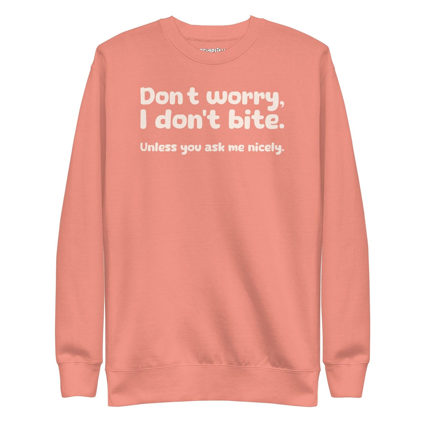 The "I Don't Bite Sweatshirt" by Pridelity, featuring the playful phrase "Don't worry, I don't bite. Unless you ask me nicely" in white text on a Team Royal background, adds a fun twist to your rainbow clothes collection.