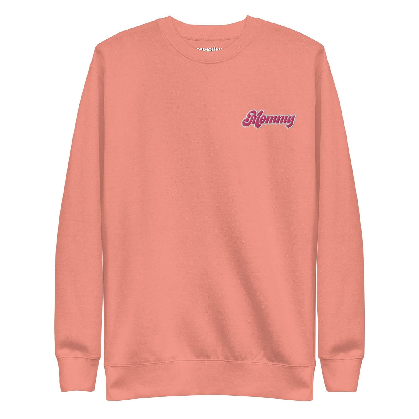 The Mommy Sweatshirt by Pridelity, part of our pride collection, showcases "Mommy" embroidered in pink on the left chest. With its long sleeves and round neckline, this black sweatshirt offers a simple, classic design that's perfect for showing pride in style.
