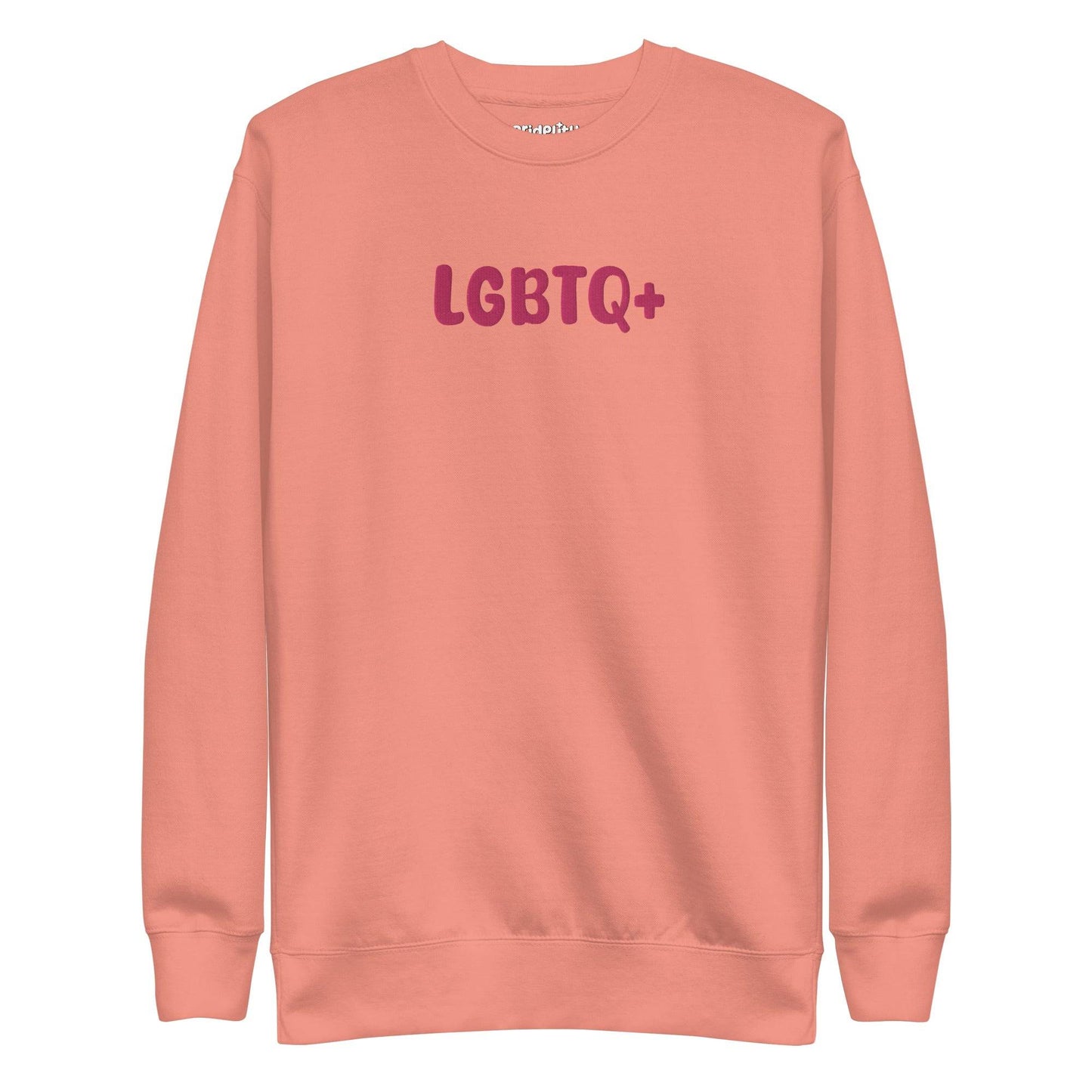 A Pridelity LGBTQ+ Sweatshirt in white, adorned with bold pink "LGBTQ+" lettering on the front, is perfect for embracing your pride with flair and aligns beautifully with the vibrant essence of rainbow apparel.