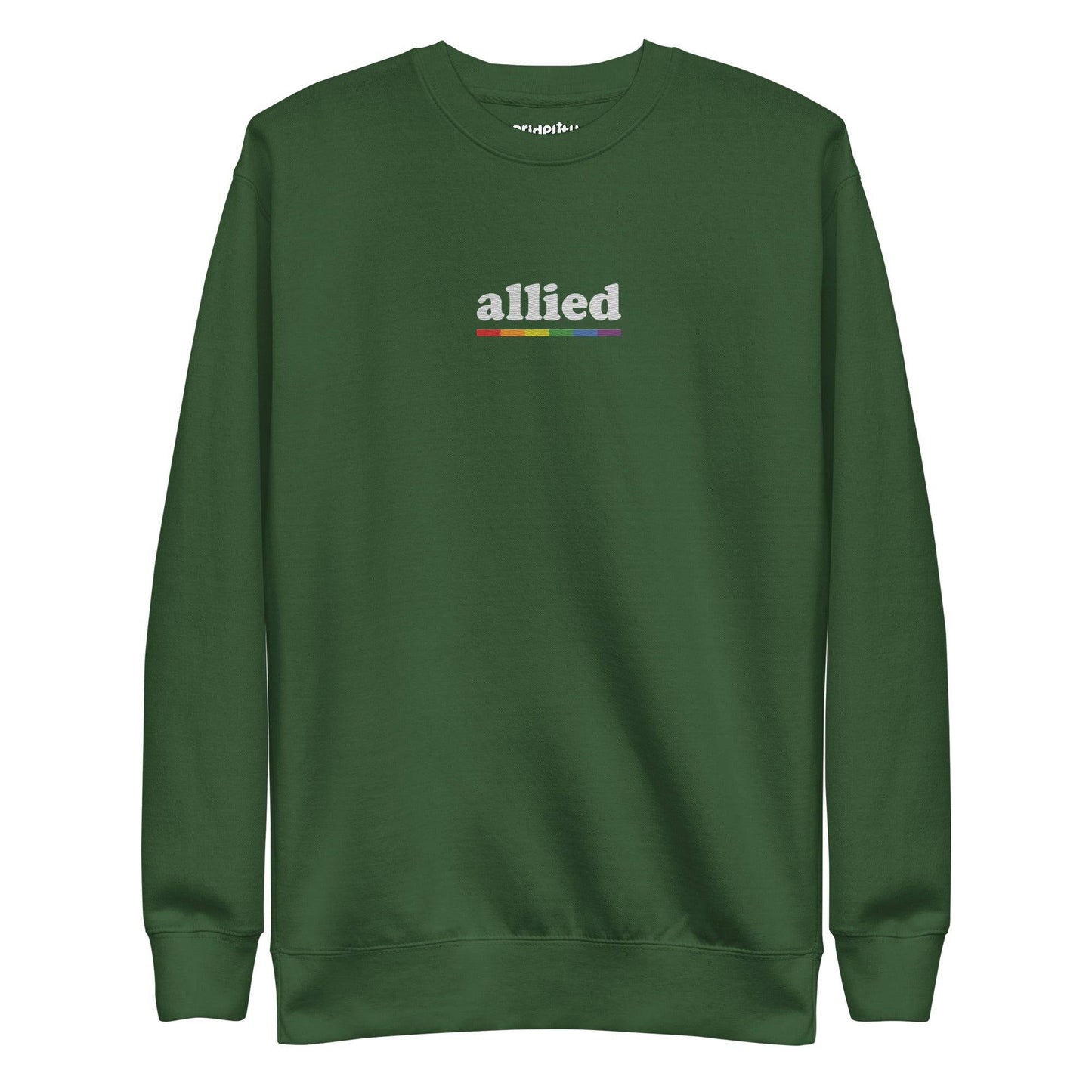 This Allied Sweatshirt by Pridelity, from our Pride Collection, showcases the word "allied" in lowercase letters. Beneath it is a multi-colored horizontal line in shades of gray, blue, yellow, black, and red to honor diversity. The look is finished with a classic crew neck for timeless style.