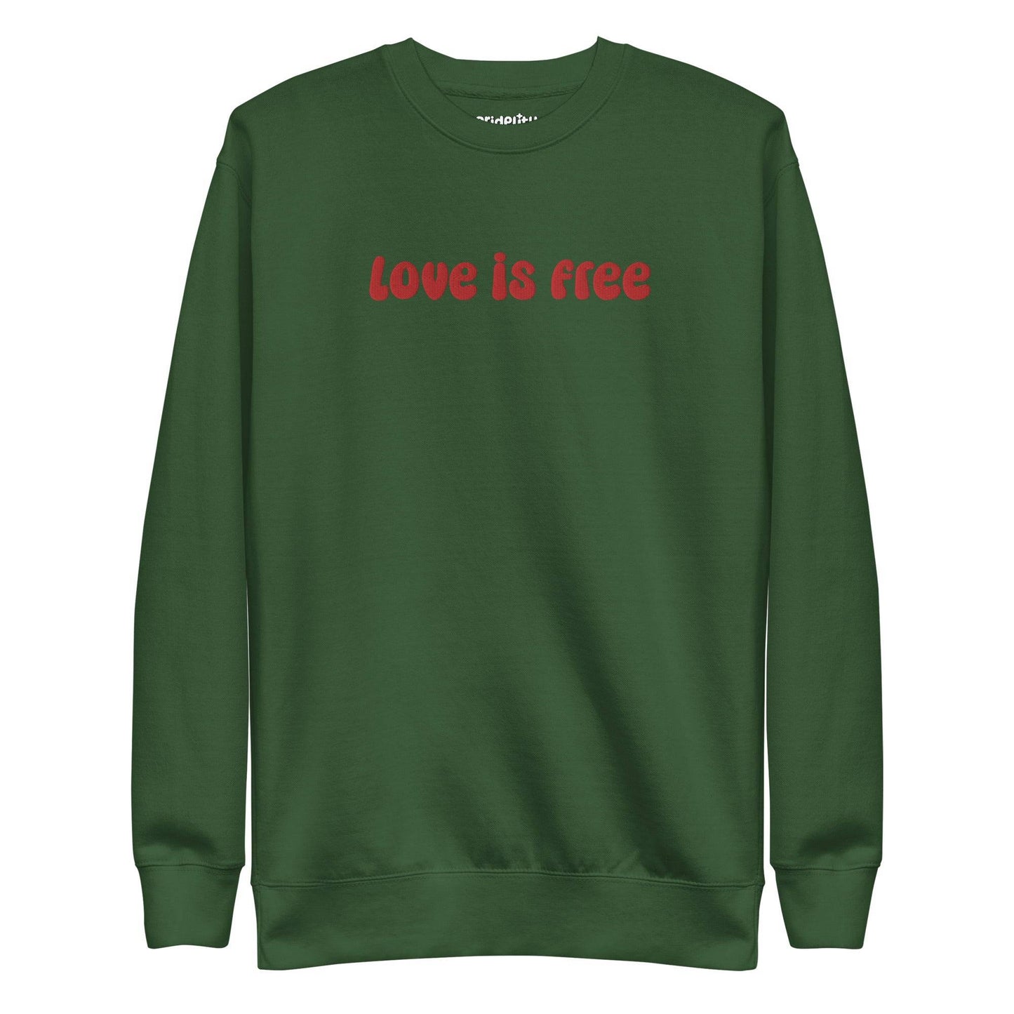 The Love Is Free Sweatshirt by Pridelity is a white sweatshirt with "love is free" boldly displayed in red letters across the chest, capturing the vibrant and inclusive essence of rainbow clothes.