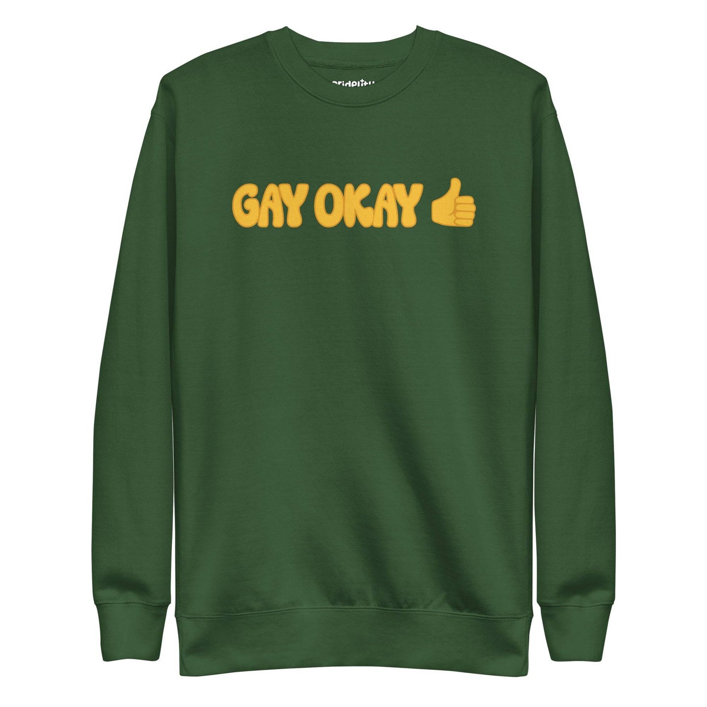 The Pridelity Gay Okay Sweatshirt is a black top adorned with the words "GAY OKAY" in bold yellow lettering and a thumbs-up emoji, offering a stylish way to celebrate pride with its rainbow-themed design.