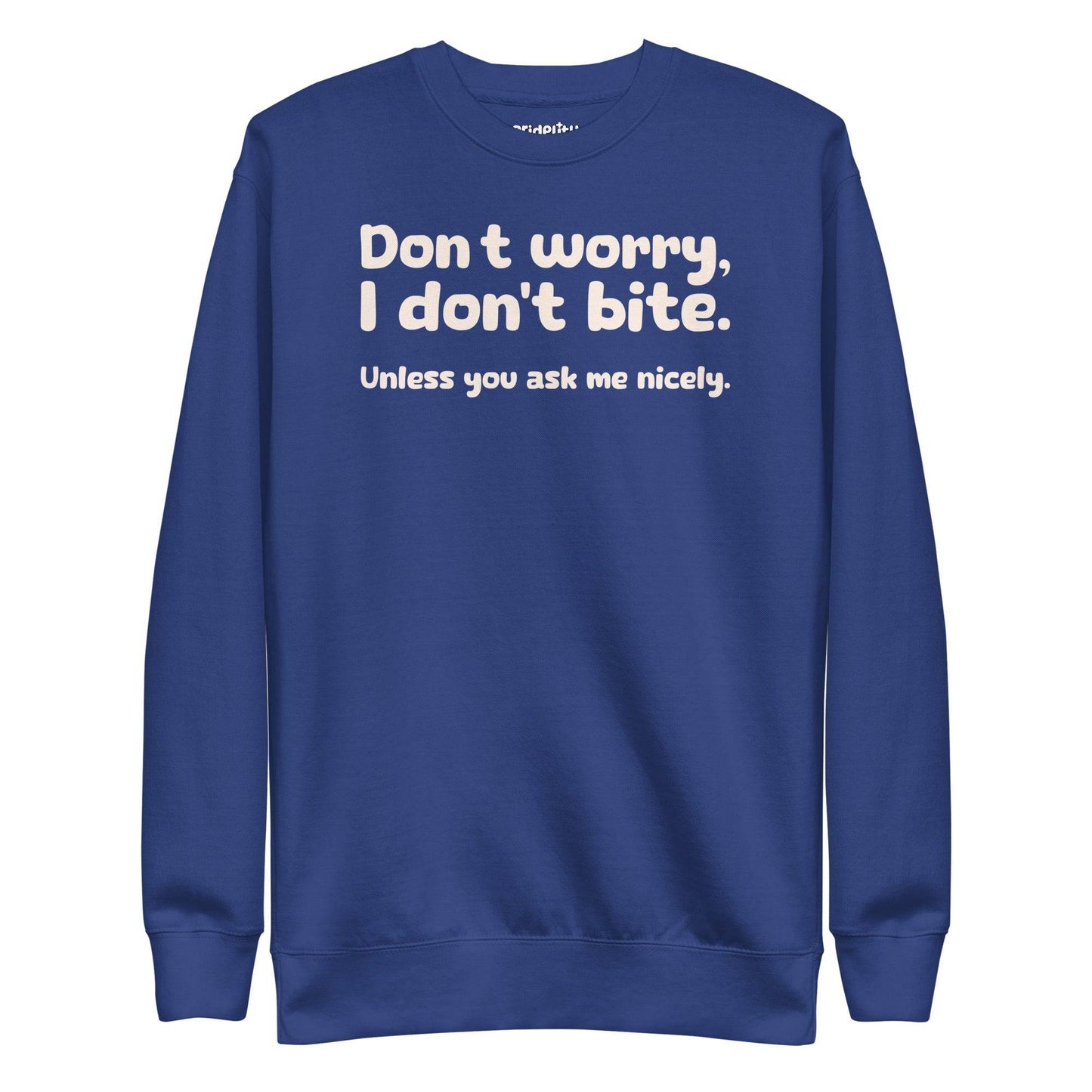 The "I Don't Bite Sweatshirt" by Pridelity, featuring the playful phrase "Don't worry, I don't bite. Unless you ask me nicely" in white text on a Team Royal background, adds a fun twist to your rainbow clothes collection.