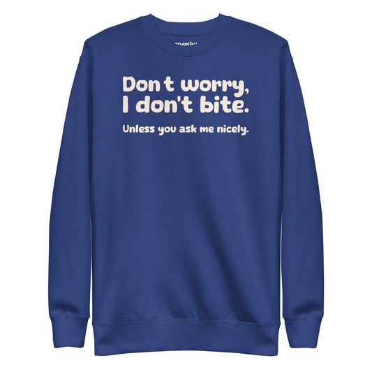 The "I Don't Bite Sweatshirt" by Pridelity, featuring the playful phrase "Don't worry, I don't bite. Unless you ask me nicely" in white text on a Team Royal background, adds a fun twist to your rainbow clothes collection.