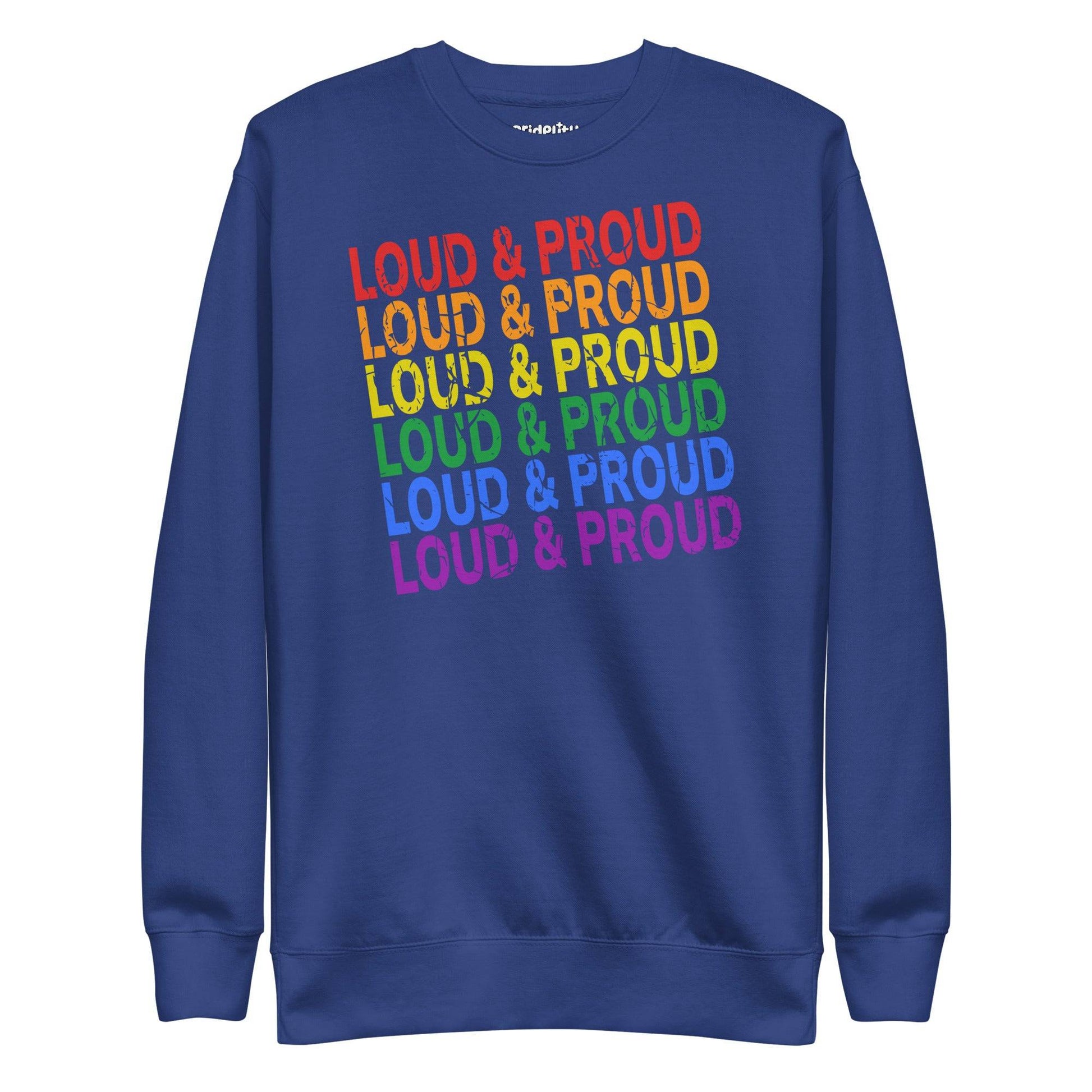 Introducing the Pridelity Loud & Proud Sweatshirt, a white garment adorned with "Loud & Proud" repeated five times in a striking rainbow gradient of red, orange, yellow, green, and blue—ideal for enthusiasts of bold and colorful fashion.