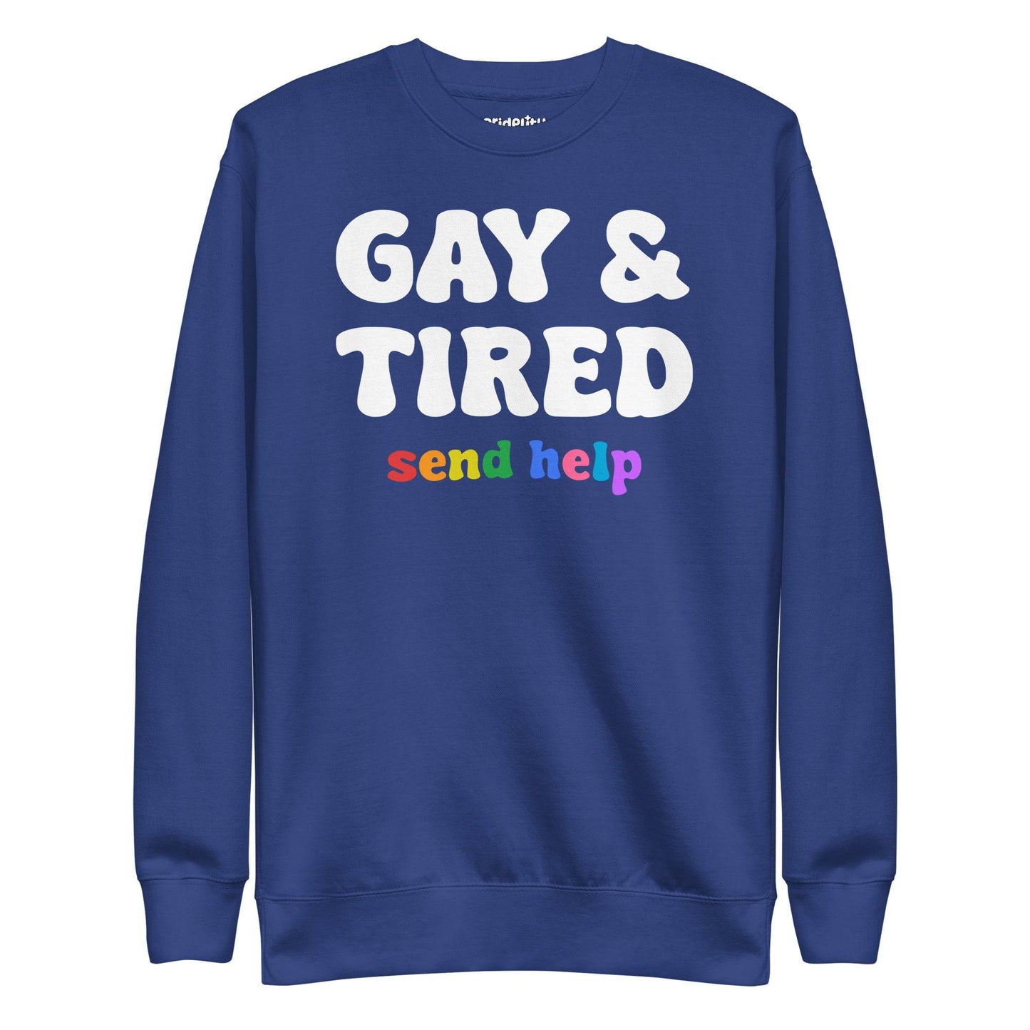 The "Gay & Tired Sweatshirt" by Pridelity is a black sweatshirt that displays bold white text saying "GAY & TIRED" along with colorful, rainbow-hued text below that reads "send help.