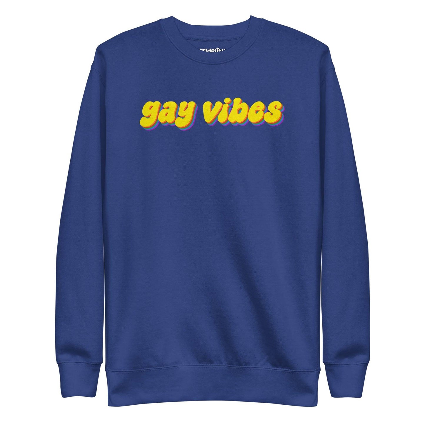 A dusty rose sweatshirt from Pridelity captures the essence of rainbow clothes style with the bold phrase "gay vibes" in yellow letters accented by purple shadows. Complementing this vibrant message, a small white "pridelity" logo is showcased above.