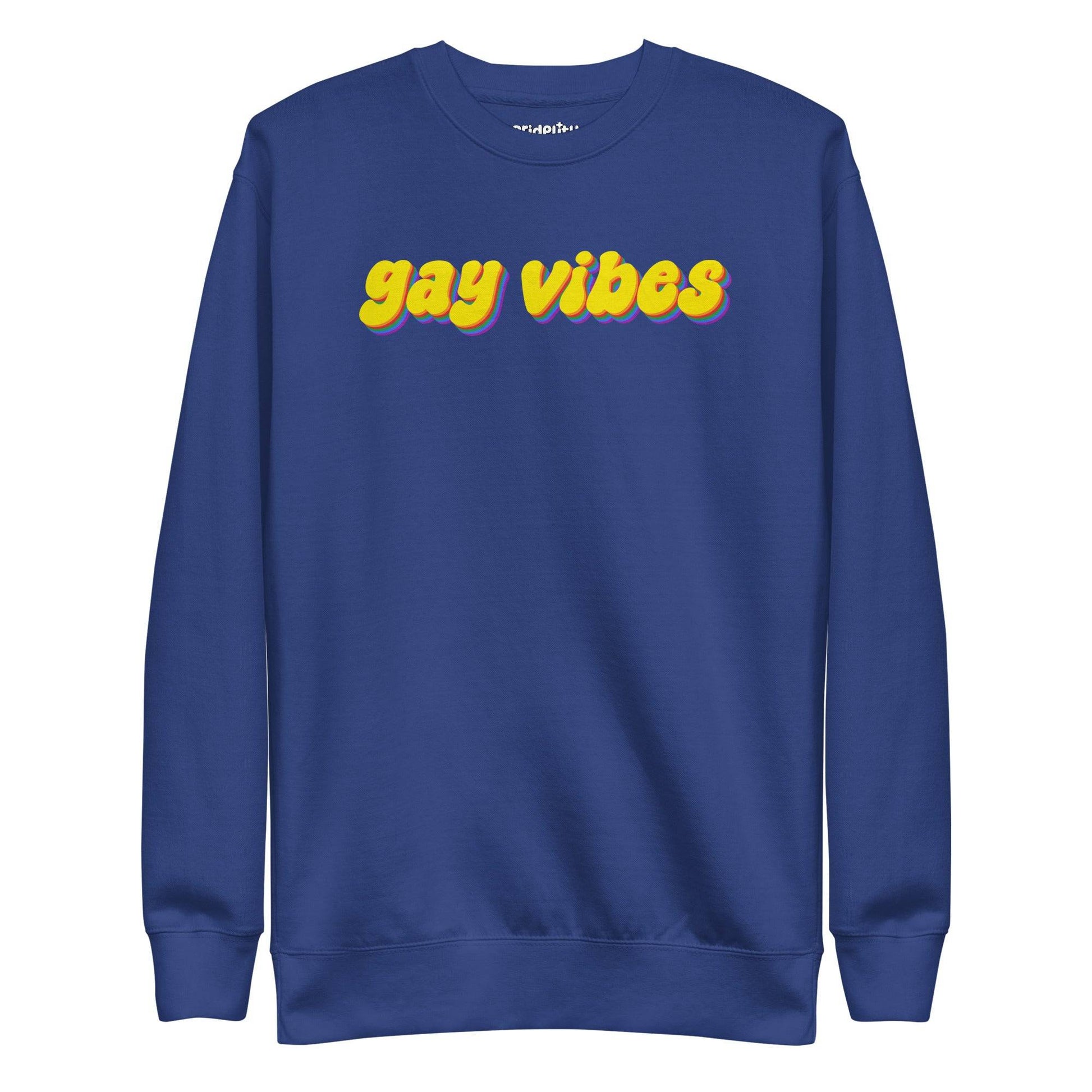 A dusty rose sweatshirt from Pridelity captures the essence of rainbow clothes style with the bold phrase "gay vibes" in yellow letters accented by purple shadows. Complementing this vibrant message, a small white "pridelity" logo is showcased above.