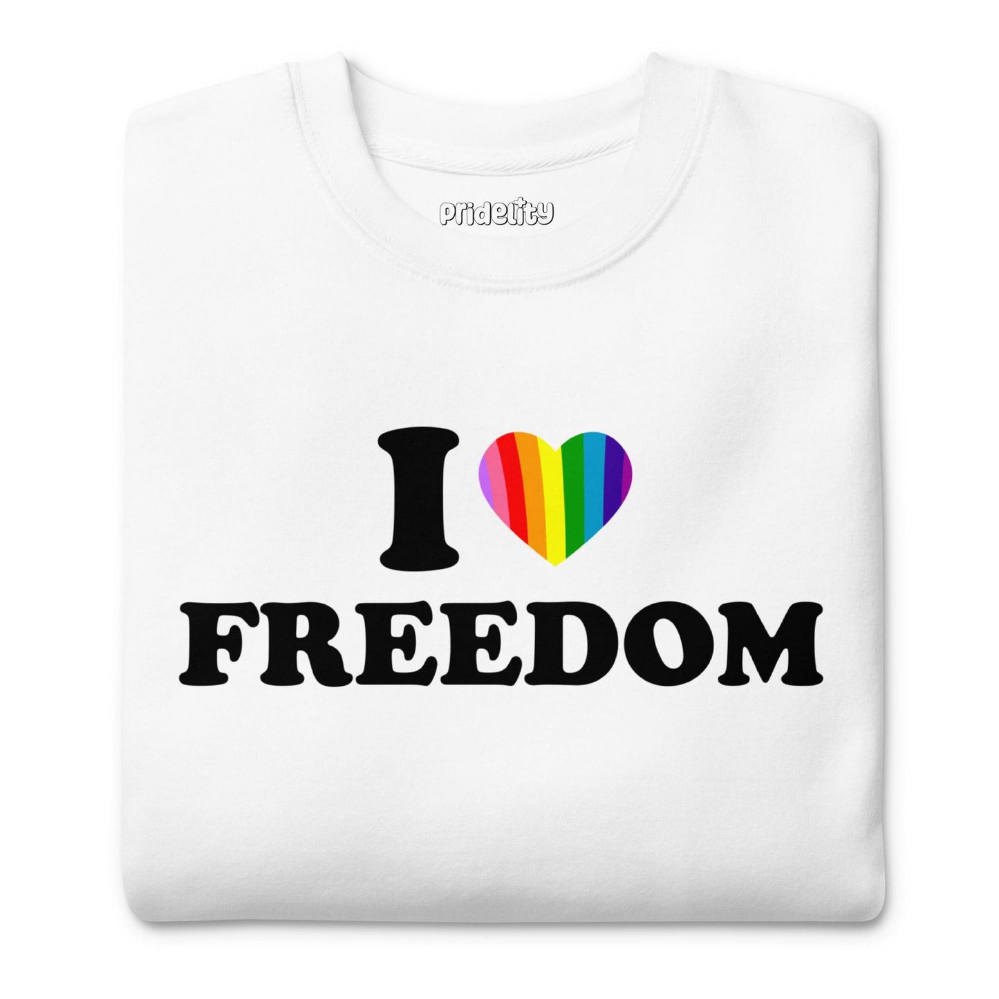 Introducing the I Love Freedom Sweatshirt by Pridelity, a stylish white garment adorned with the phrase "I ♥ FREEDOM," where the heart symbol is vividly colored in rainbow hues—a must-have for fans of rainbow-themed apparel.