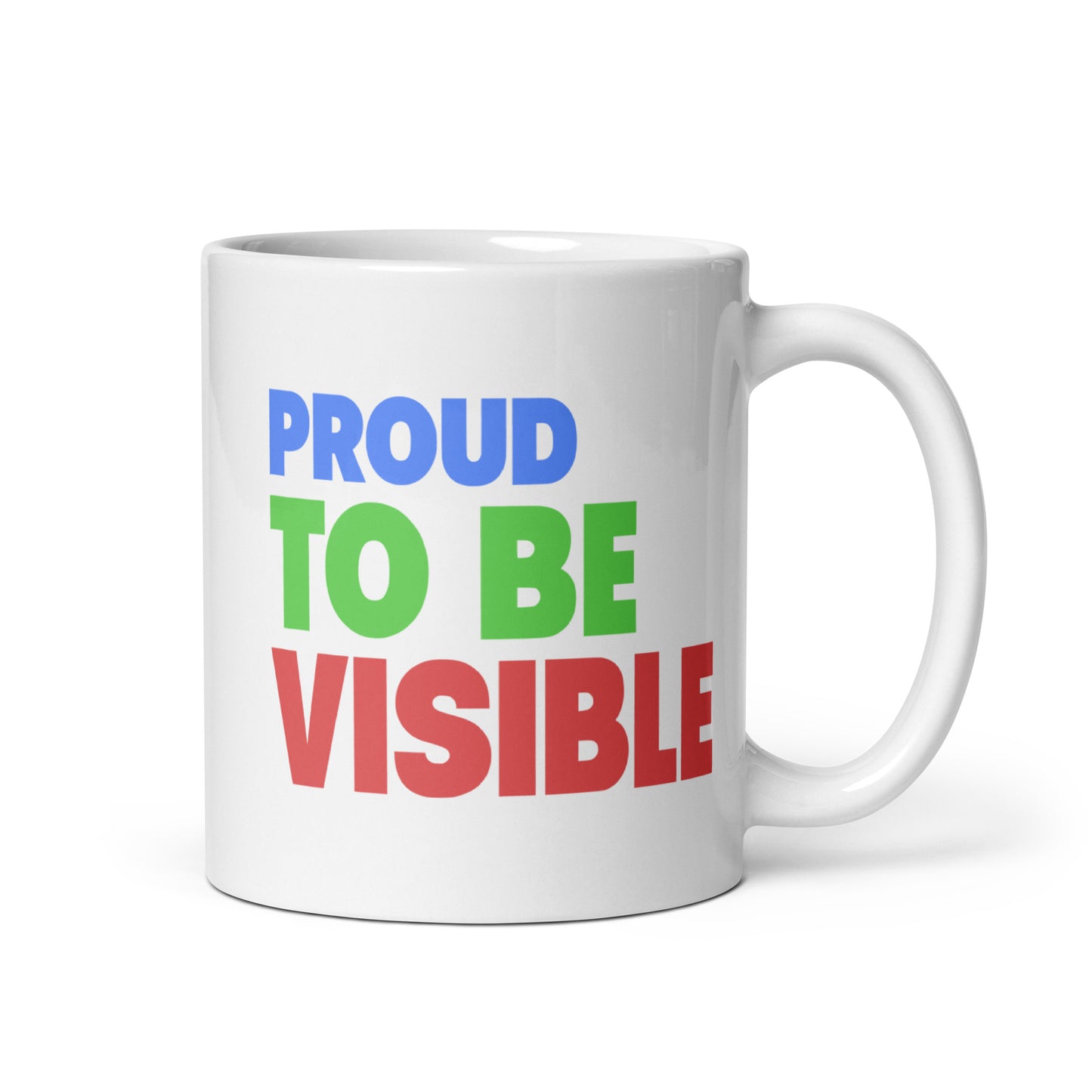 The Proud To Be Visible Mug from Pridelity's Pride Collections 2025 series showcases the phrase "Proud to Be Visible" in striking, colorful letters: "Proud" in blue, "To Be" in green, and "Visible" in red.