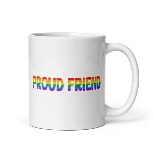 A white mug from Pridelity's Pride Collection 2025 features the words "Proud Friend" in bold, rainbow-colored letters.