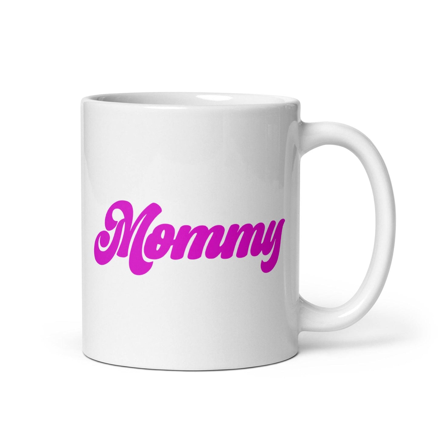 A Mommy Mug by Pridelity, part of the Pride Collections 2025, showcases "Mommy" printed in bold pink letters on a white ceramic mug.