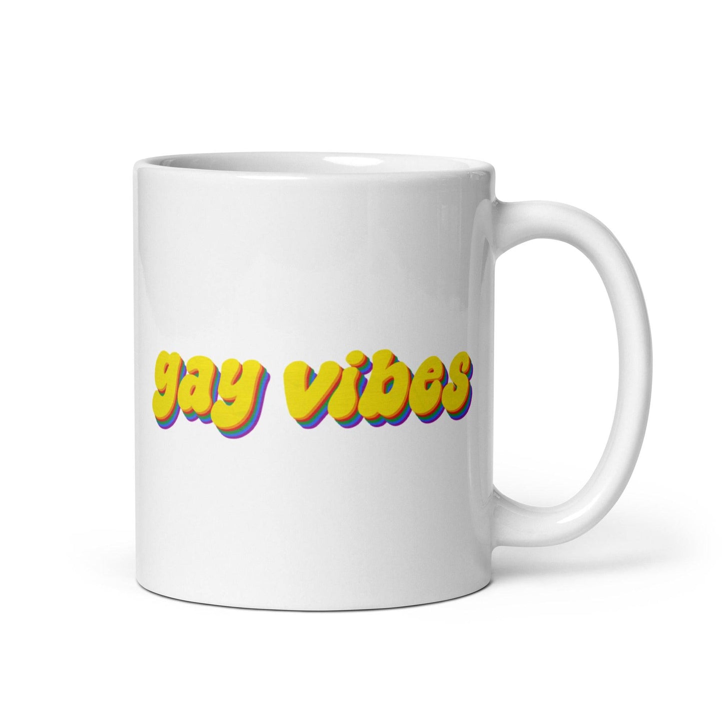 The Gay Vibes Mug by Pridelity, featuring bold yellow "gay vibes" text with a shadow effect on a white background, is included in the best pride collections of 2025.