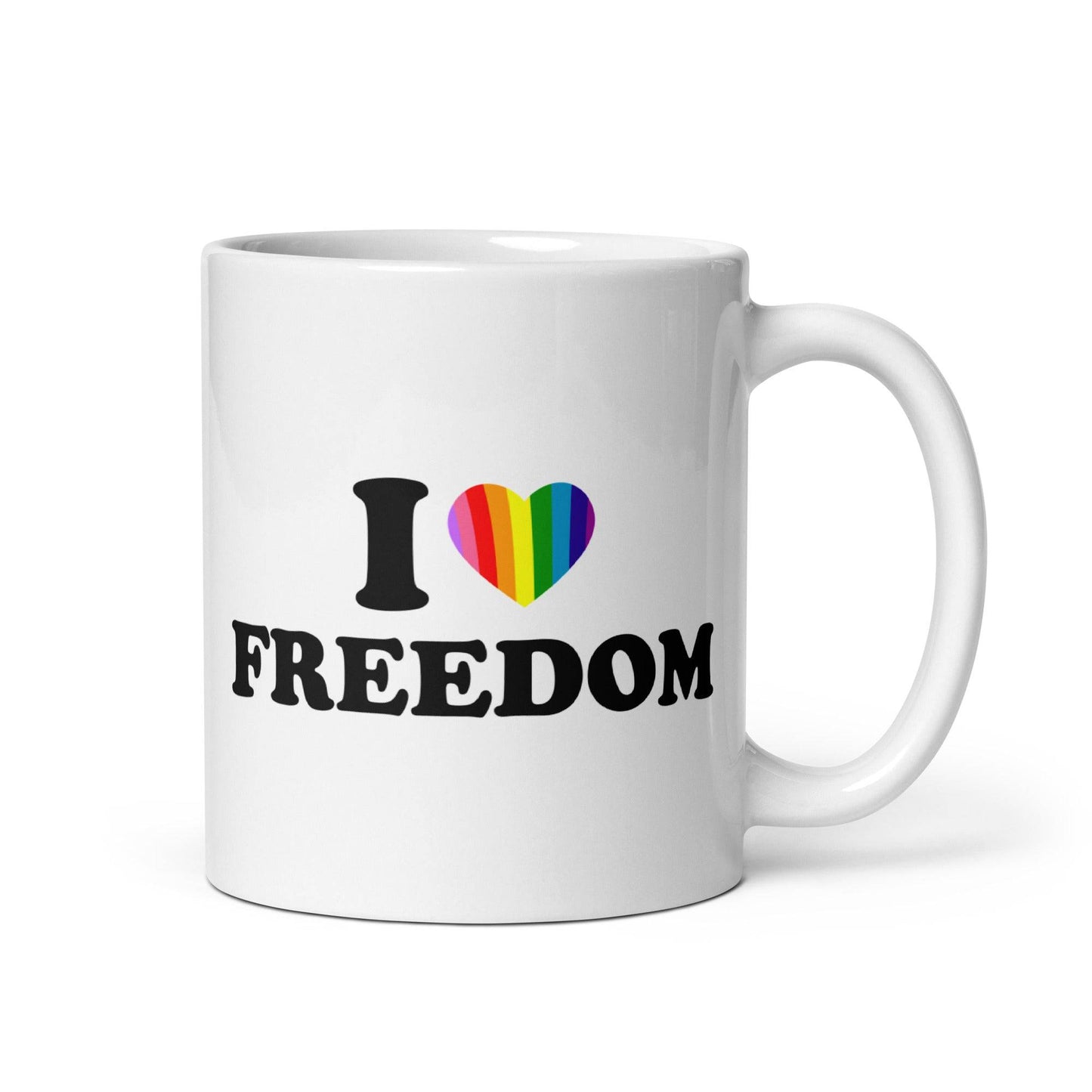 The "I Love Freedom Mug" by Pridelity is a white mug adorned with the text "I ♥ FREEDOM," where the heart symbol is filled with rainbow colors, making it a standout piece in the best pride collections of 2025.