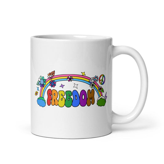 Introducing the Freedom Mug from Pridelity's top Pride Collections 2025, featuring the word "FREEDOM" in vibrant, bold letters. The design is enhanced with a rainbow adorned with flowers, stars, and a peace sign for a lively and playful touch.
