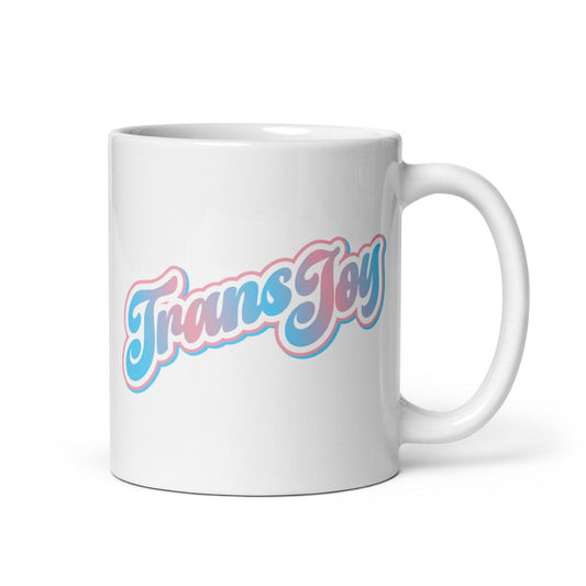 The "Trans Joy Mug" from Pridelity's Pride Collection 2025 features the text "Trans Joy" in blue and pink cursive letters with a shadow effect against a plain white background.