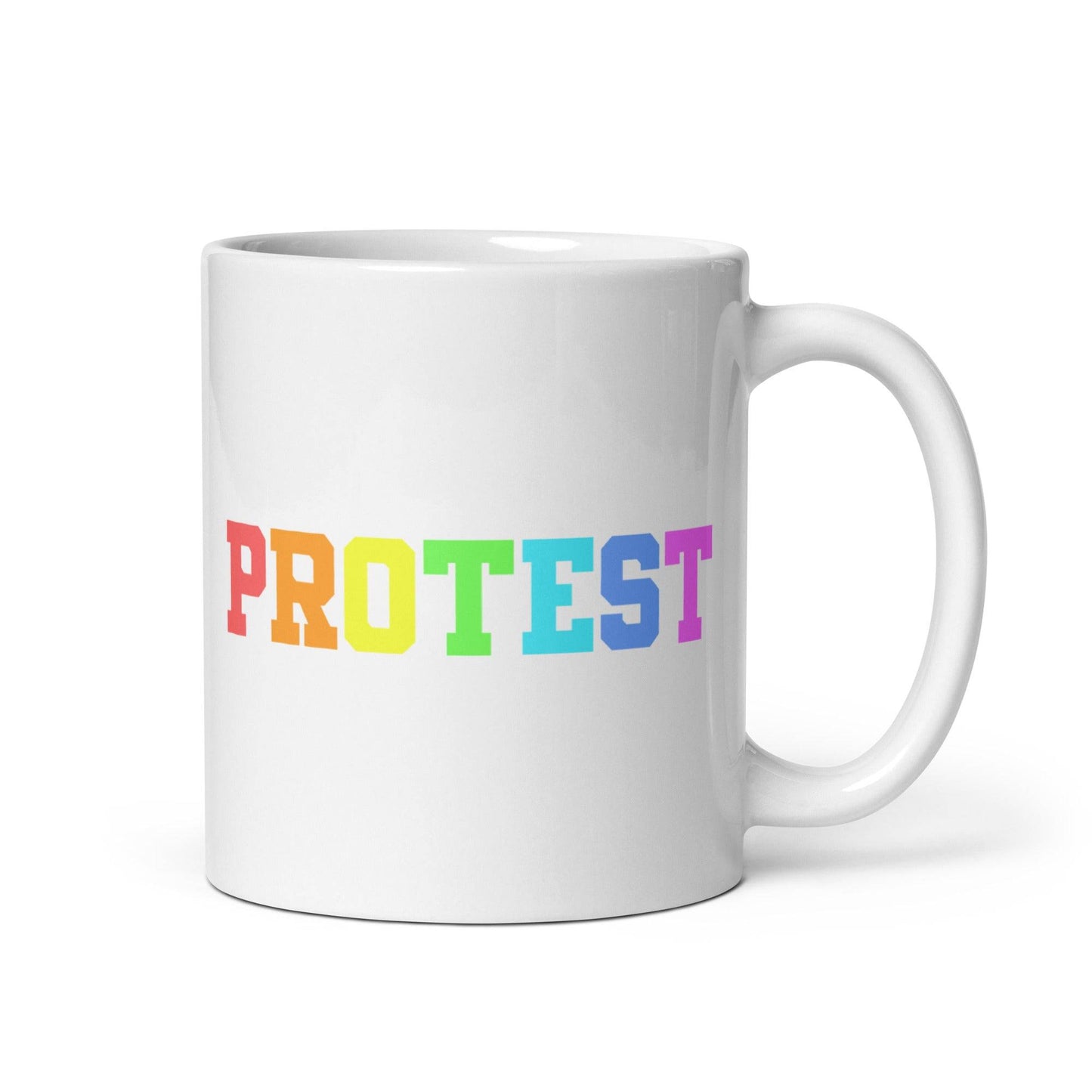 The Protest Mug by Pridelity from the Pride Collections 2025 features the word "PROTEST" in bold, capital letters. The gradient rainbow design elegantly transitions from red to purple, celebrating diversity and equality.