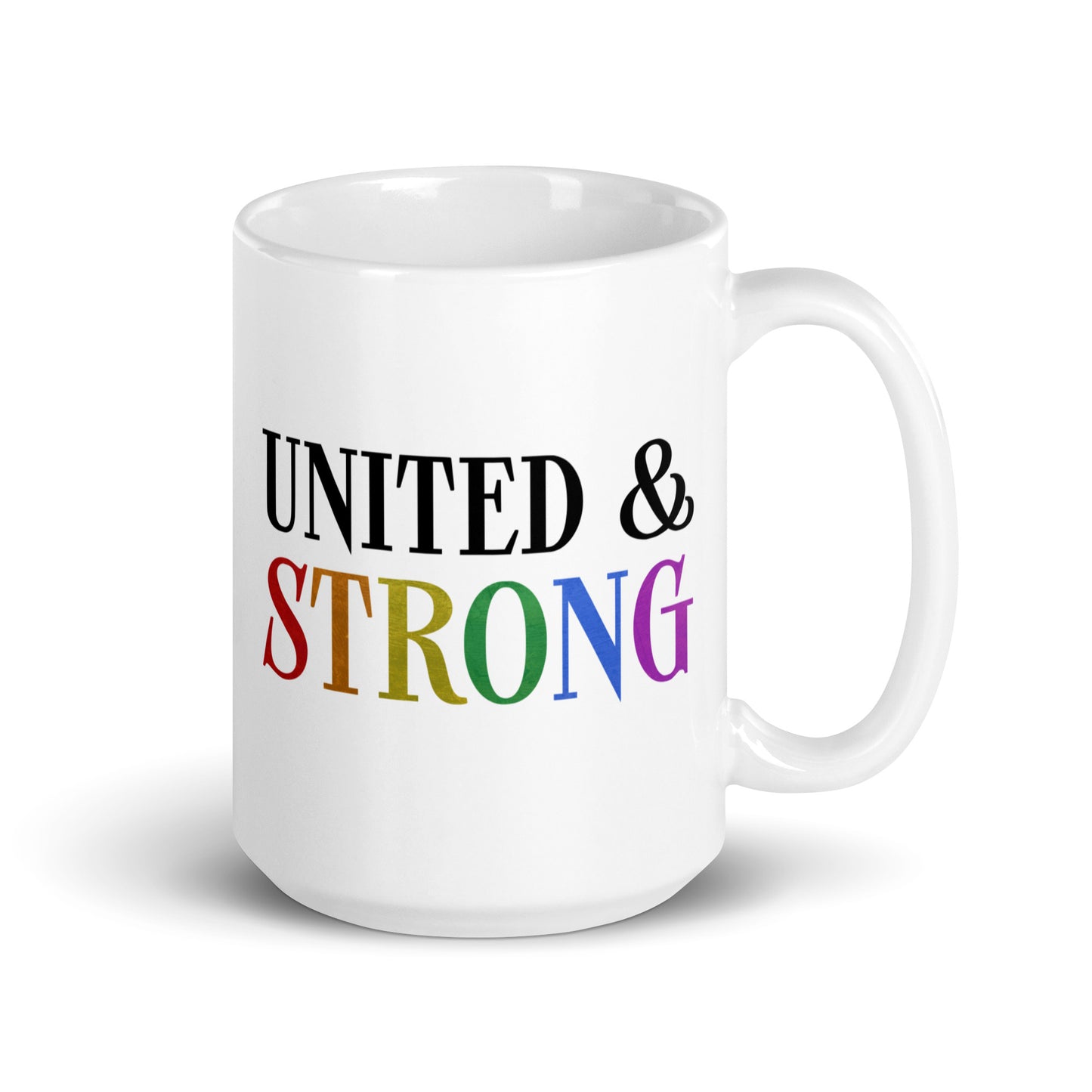 The United & Strong Mug by Pridelity from the Pride Collection 2025 showcases the phrase "UNITED & STRONG," with "STRONG" highlighted in vibrant rainbow colors, symbolizing diversity and unity. This white ceramic mug features a simple, classic design with a right-sided handle.