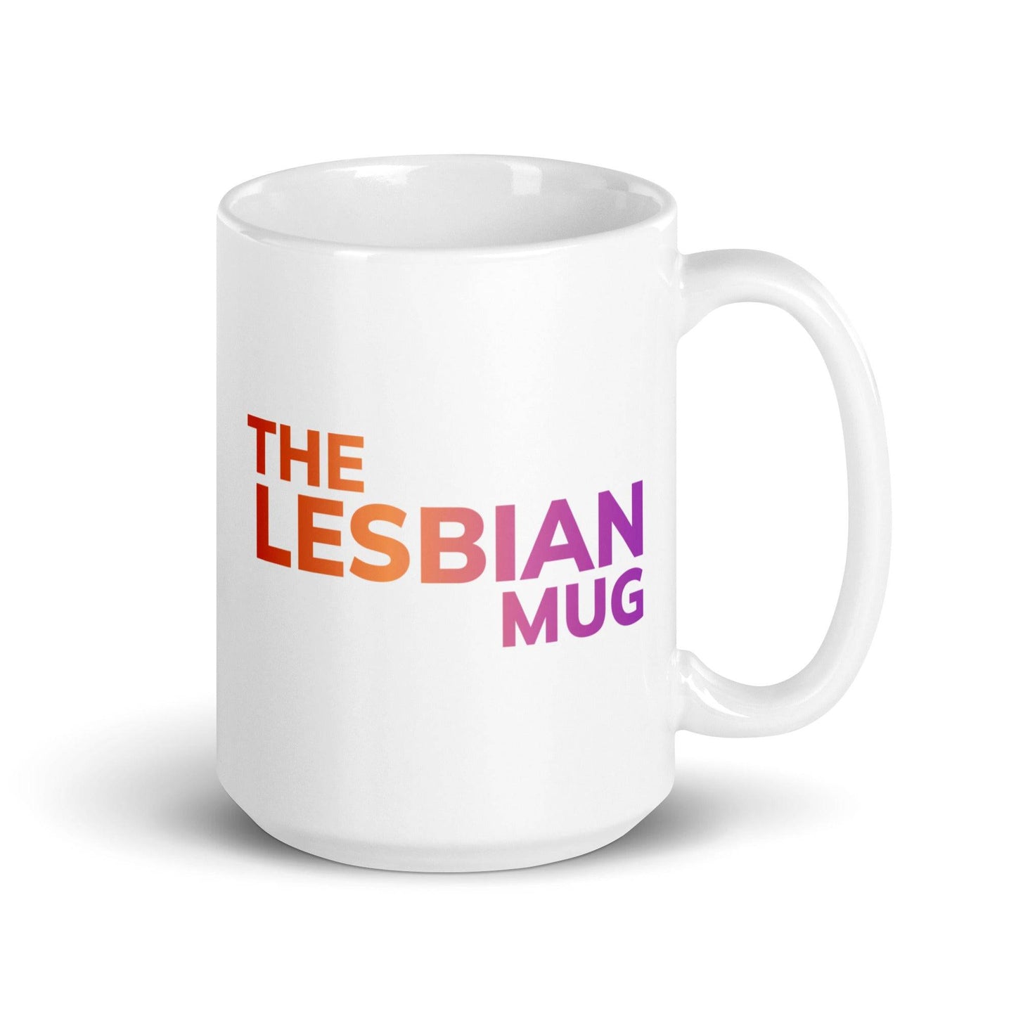 The Pridelity "The Lesbian Mug" is a stylish white ceramic mug featuring the phrase "THE LESBIAN MUG" in a striking gradient from orange to purple, prominently displayed at its center. A proud addition to the pride collections of 2025, it celebrates identity with flair.