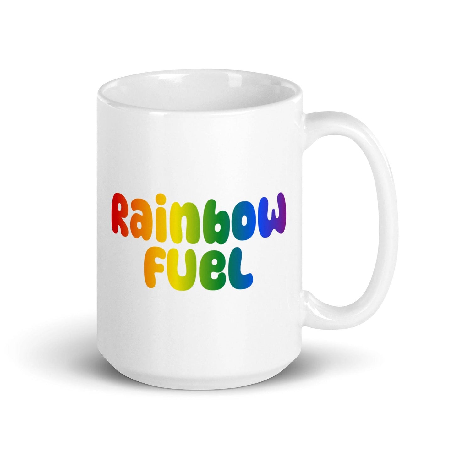 Introducing the Pridelity Rainbow Fuel Mug: a simple yet vibrant white mug featuring "Rainbow Fuel" in bold, colorful letters with a stunning rainbow gradient, as part of our Pride Collections 2025. The handle is conveniently placed on the right side.