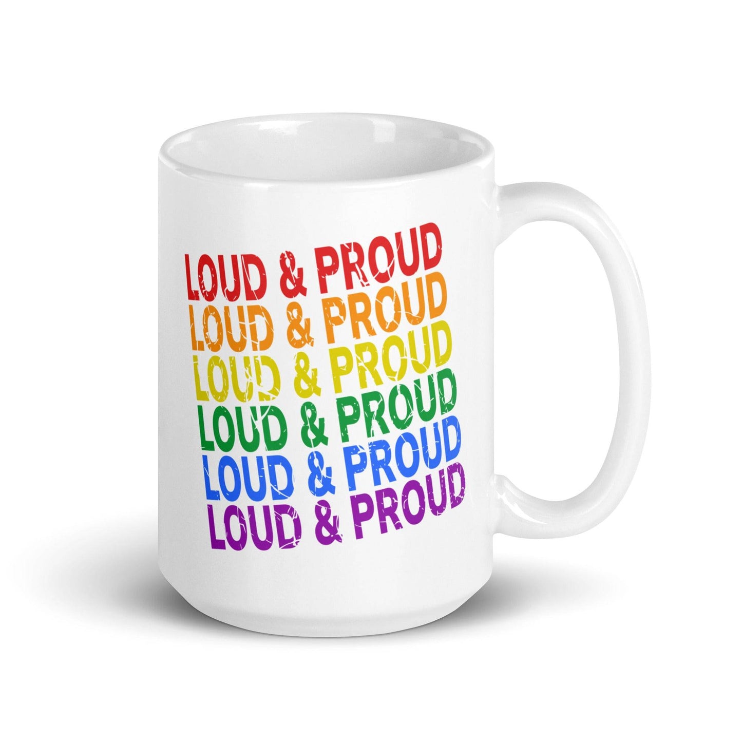 The Loud & Proud Mug by Pridelity, part of the Pride Collection 2025, is a white mug featuring "Loud & Proud" repeated seven times in a vertical rainbow pattern: red, orange, yellow, green, blue, indigo, and violet.