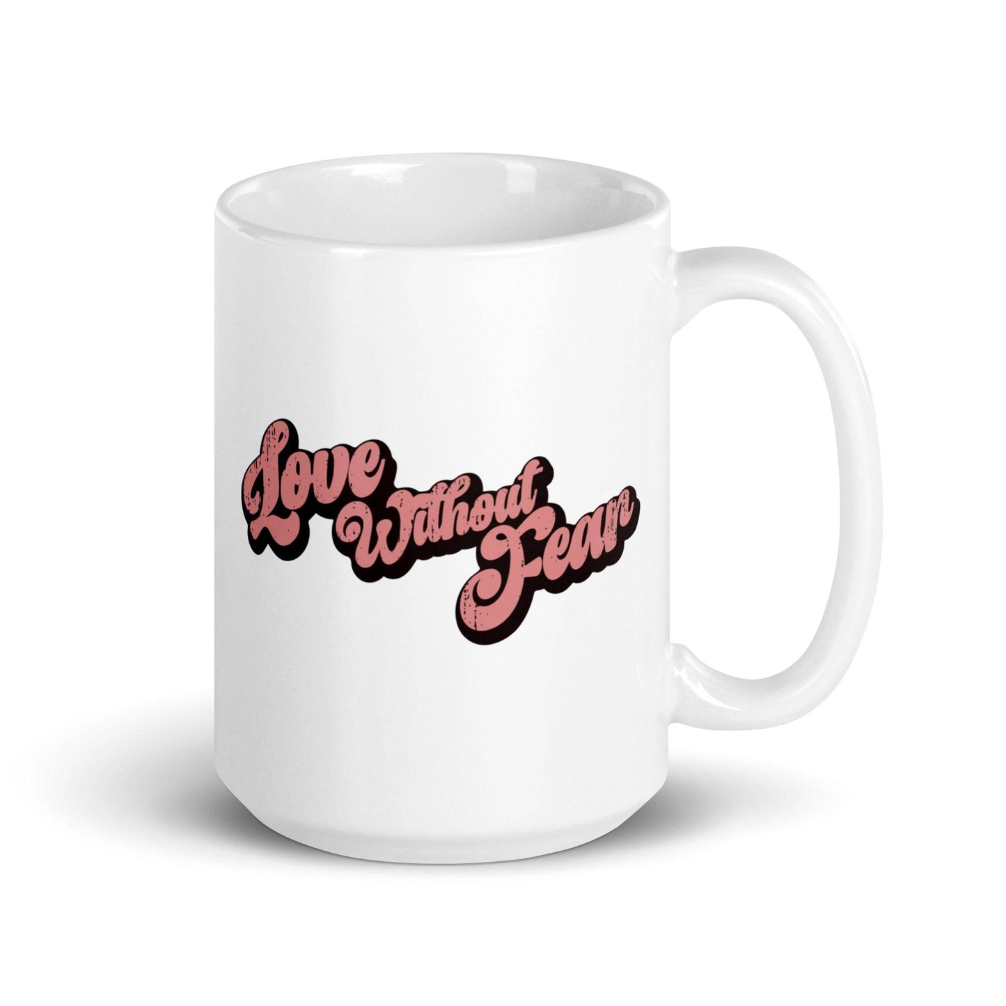 The Love Without Fear Mug by Pridelity is a white mug from the Pride Collections 2025, showcasing "Love Without Fear" in bold pink text with a black outline, elegantly written in a vintage-style cursive font.