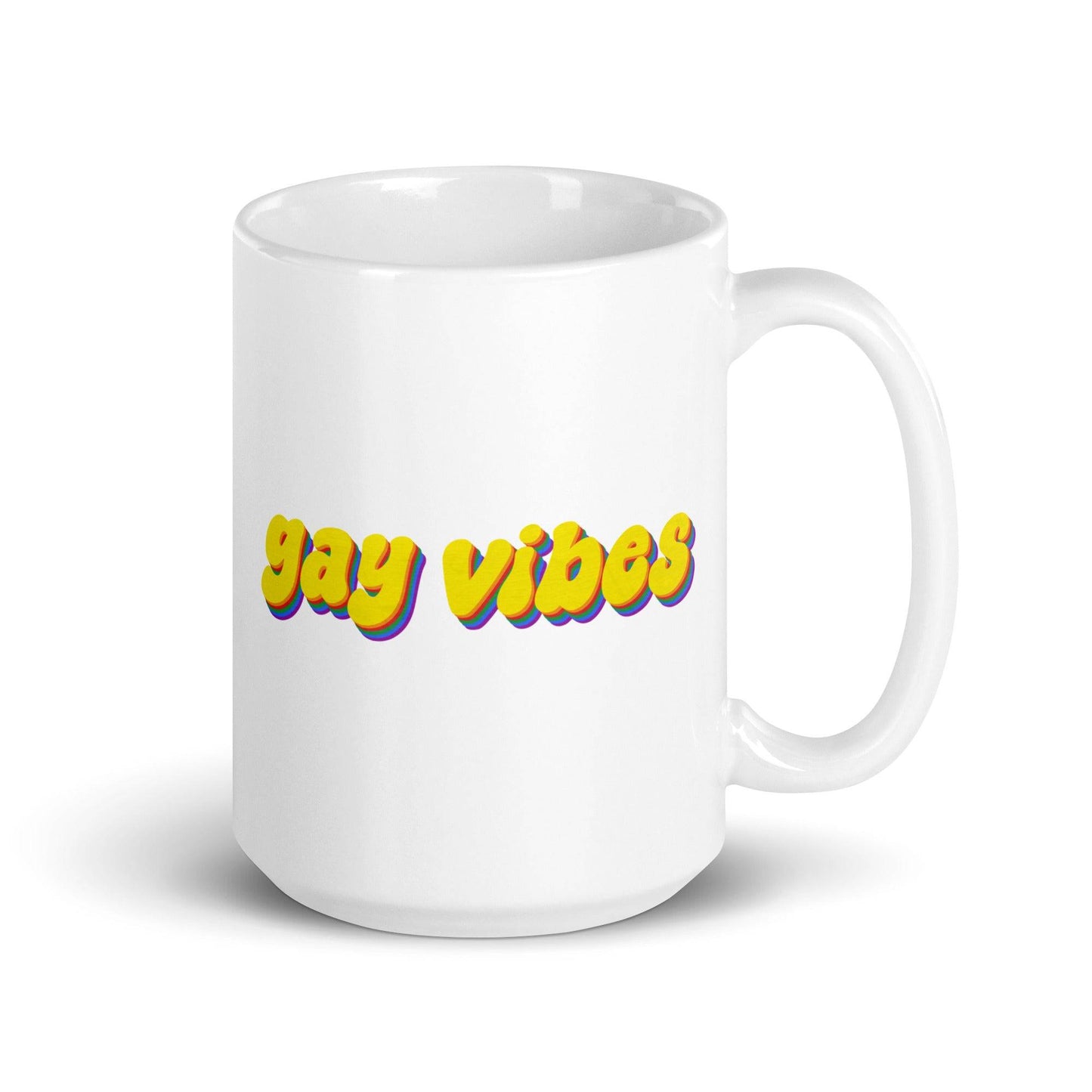 The Gay Vibes Mug by Pridelity, featuring bold yellow "gay vibes" text with a shadow effect on a white background, is included in the best pride collections of 2025.