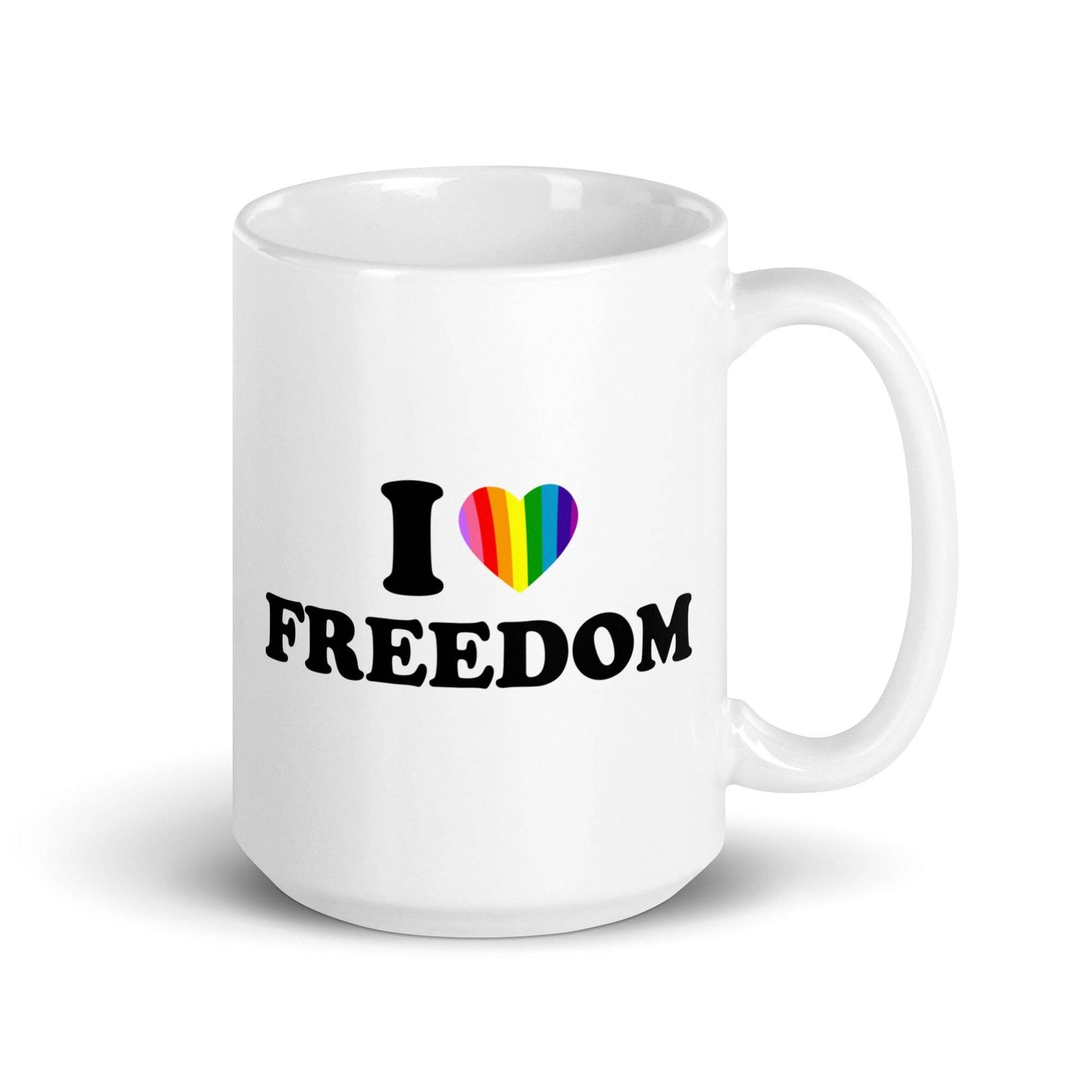 The "I Love Freedom Mug" by Pridelity is a white mug adorned with the text "I ♥ FREEDOM," where the heart symbol is filled with rainbow colors, making it a standout piece in the best pride collections of 2025.