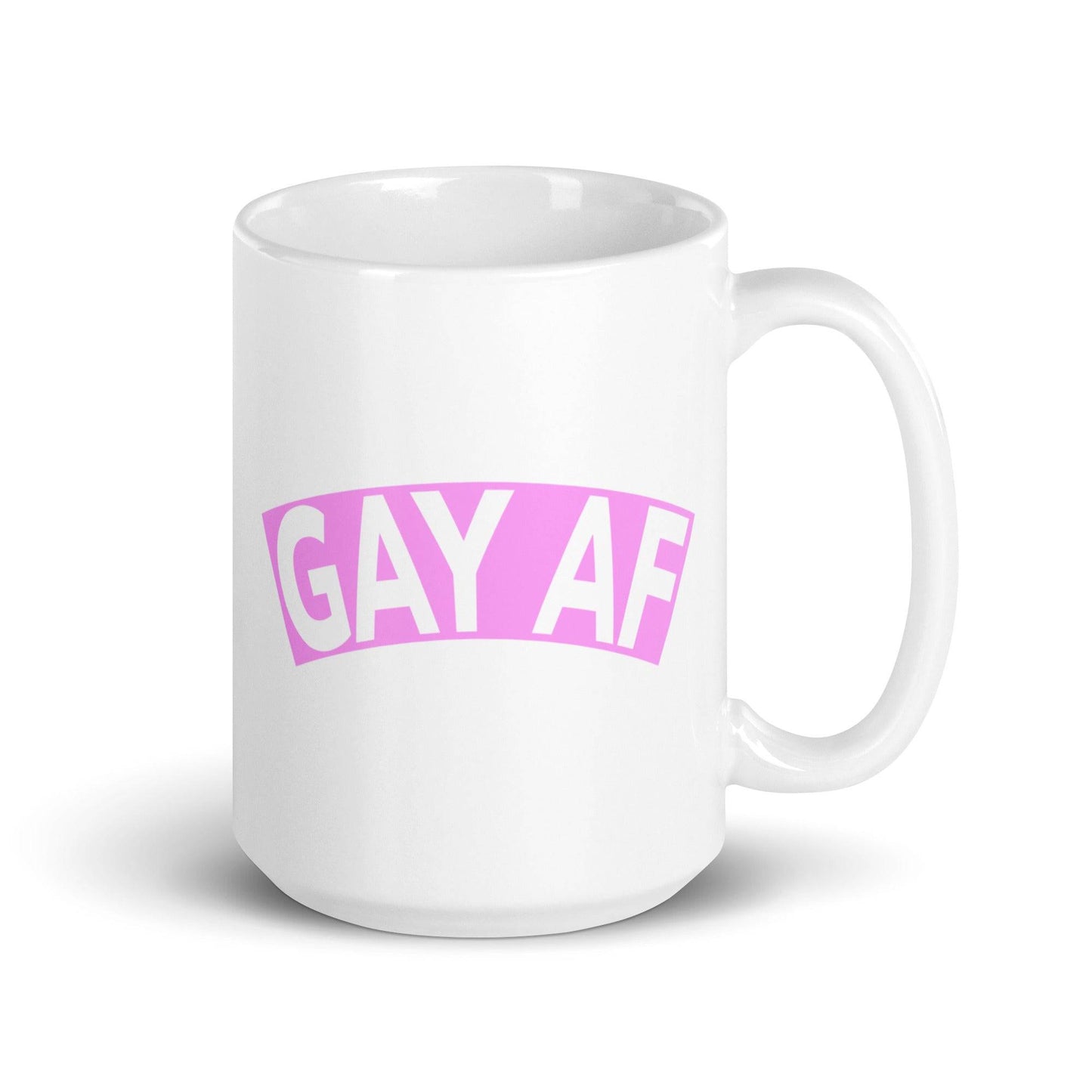 The Gay AF Mug by Pridelity is a white mug from the premier Pride Collections 2025, featuring "GAY AF" boldly centered in pink uppercase letters that dominate the design.