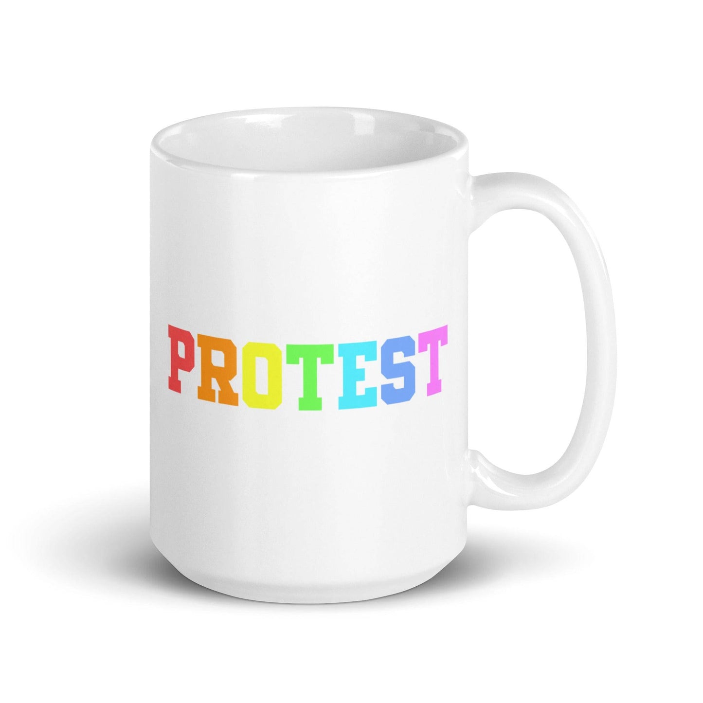 The Protest Mug by Pridelity from the Pride Collections 2025 features the word "PROTEST" in bold, capital letters. The gradient rainbow design elegantly transitions from red to purple, celebrating diversity and equality.