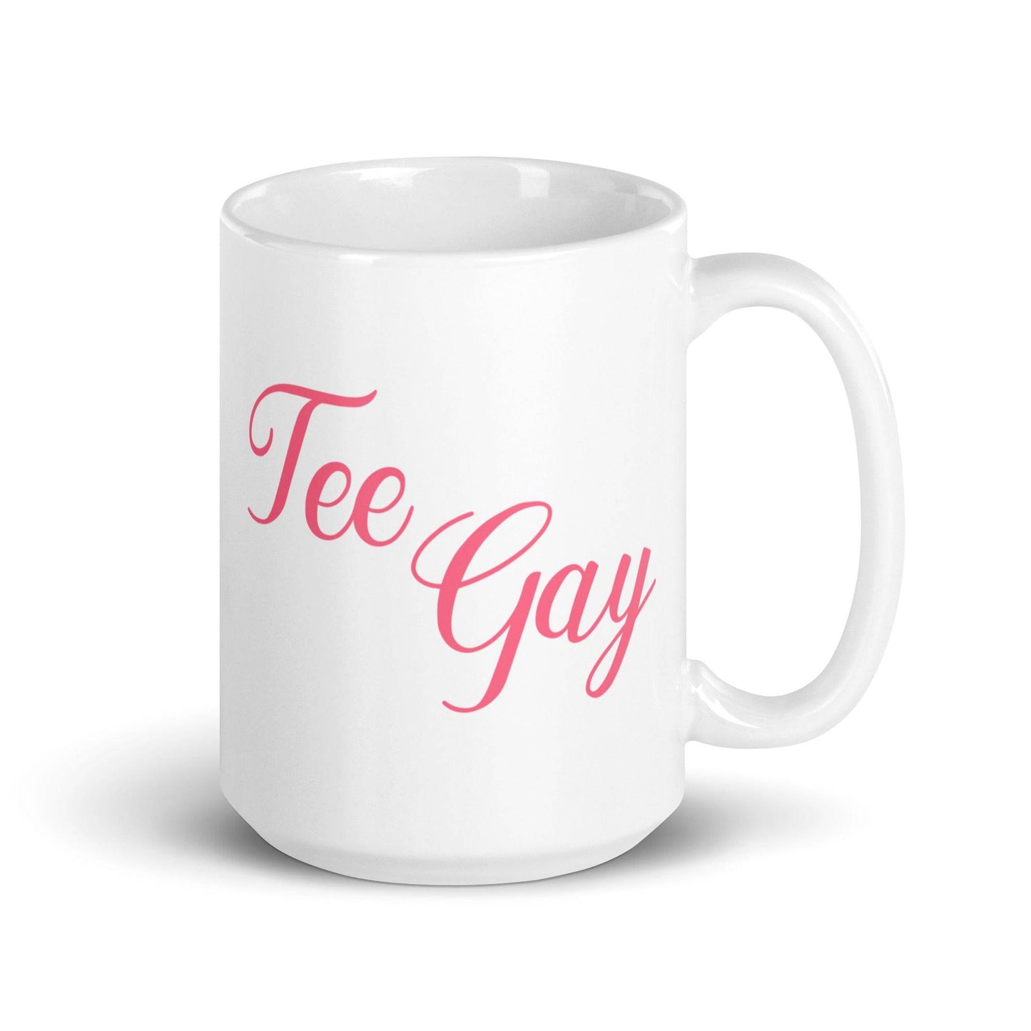 Stylish white mug with 'Tee Gay' in pink cursive lettering, combining humor and pride for your daily coffee or tea moments.