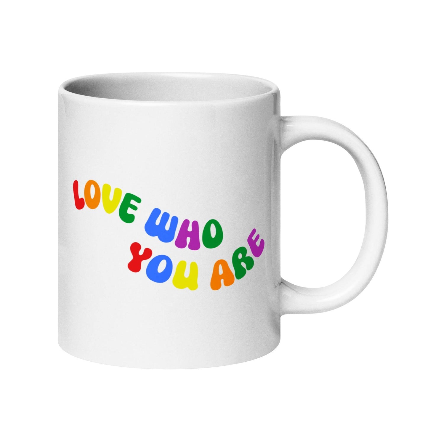 The Love Who You Are Mug by Pridelity is a white mug featuring vibrant letters spelling "LOVE WHO YOU ARE" on its side. It has a smooth handle and a simple background, and is part of the Pride Collections 2025, celebrating uniqueness and self-love.
