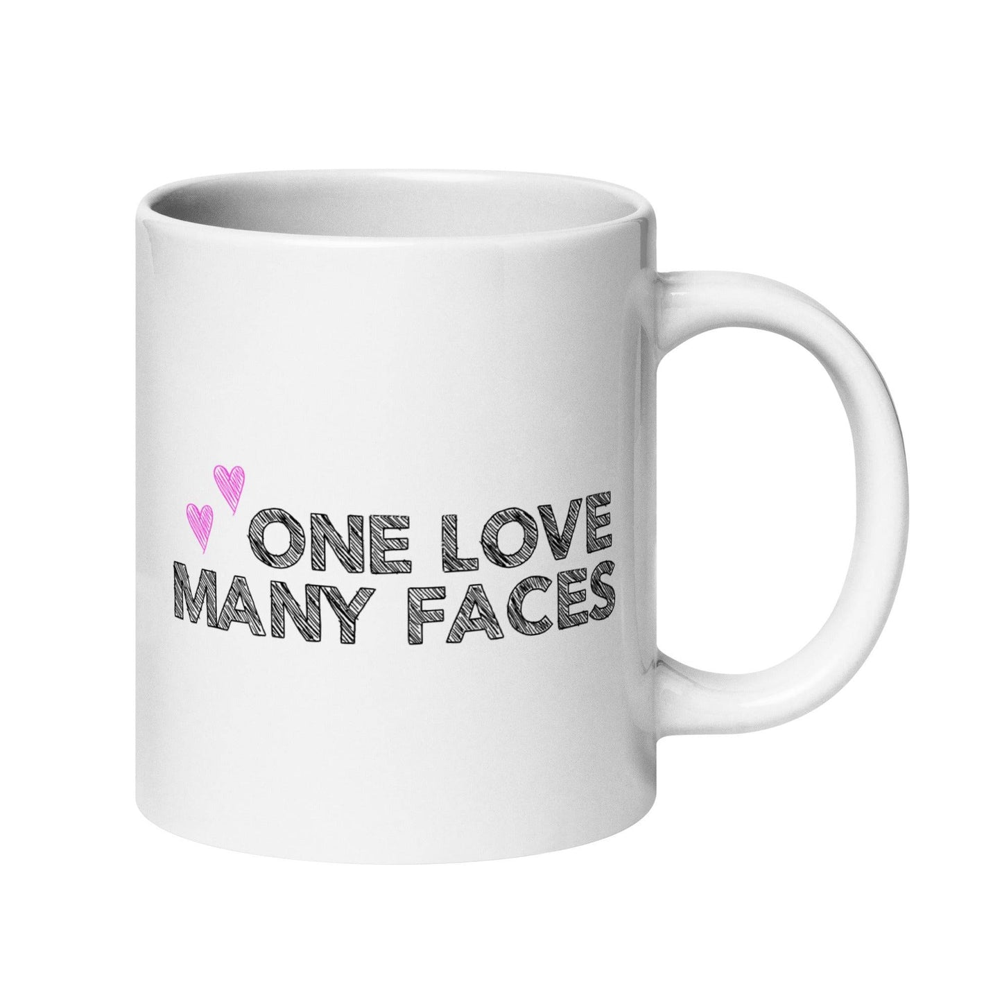 The One Love Many Faces Mug by Pridelity, part of the Pride Collections 2025, showcases the phrase "One Love Many Faces" in bold black letters. It is adorned with two small pink hearts on the left side above the text, all set against a plain white background to celebrate unity and diversity.