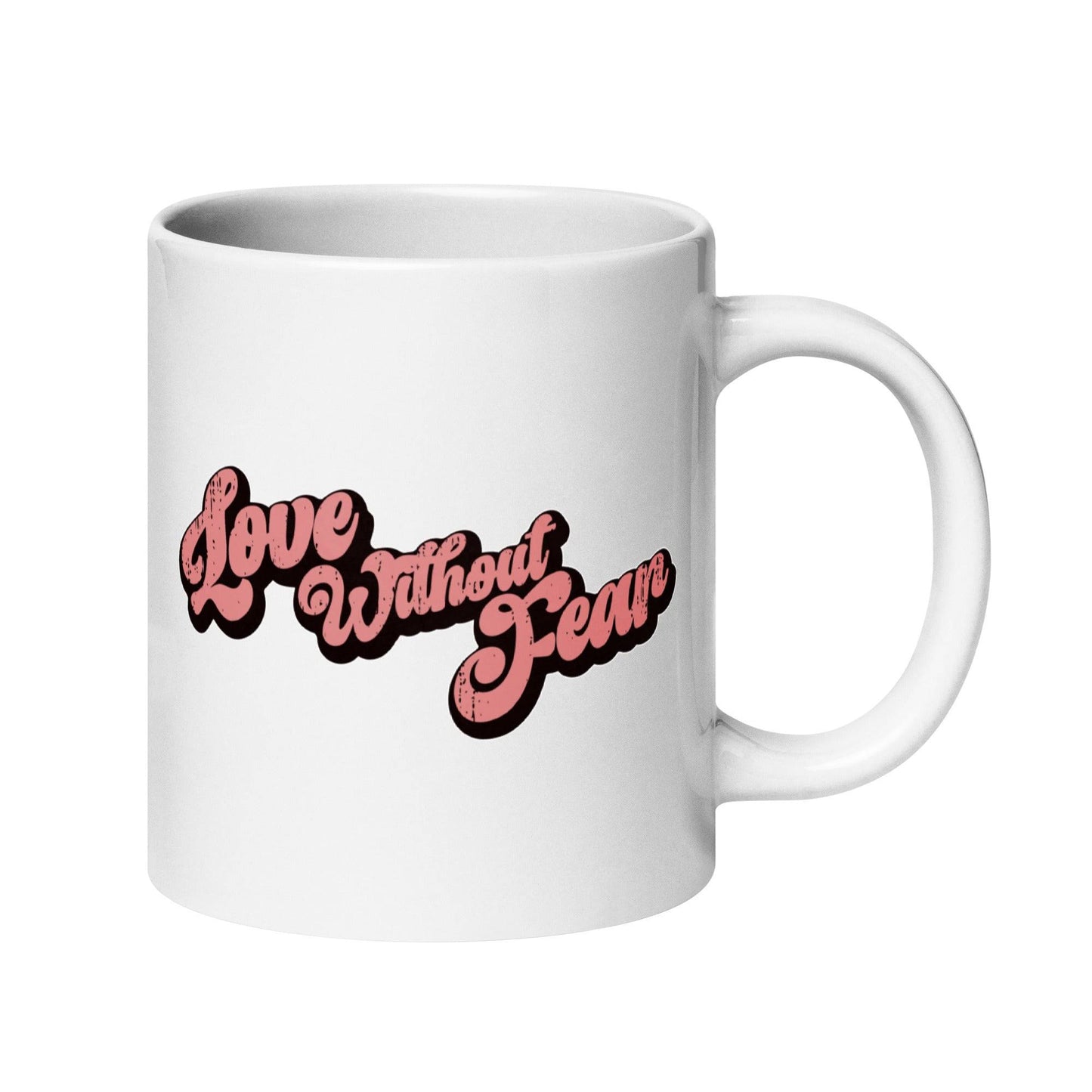 The Love Without Fear Mug by Pridelity is a white mug from the Pride Collections 2025, showcasing "Love Without Fear" in bold pink text with a black outline, elegantly written in a vintage-style cursive font.
