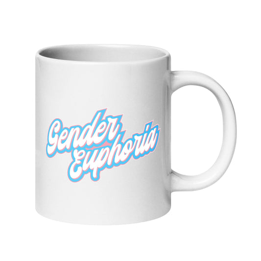 A product from Pridelity's best Pride collections for 2025, the Gender Euphoria Mug features a white coffee mug with the phrase "Gender Euphoria" elegantly scripted in blue and pink against a plain white backdrop.