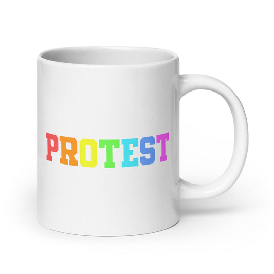 The Protest Mug by Pridelity from the Pride Collections 2025 features the word "PROTEST" in bold, capital letters. The gradient rainbow design elegantly transitions from red to purple, celebrating diversity and equality.