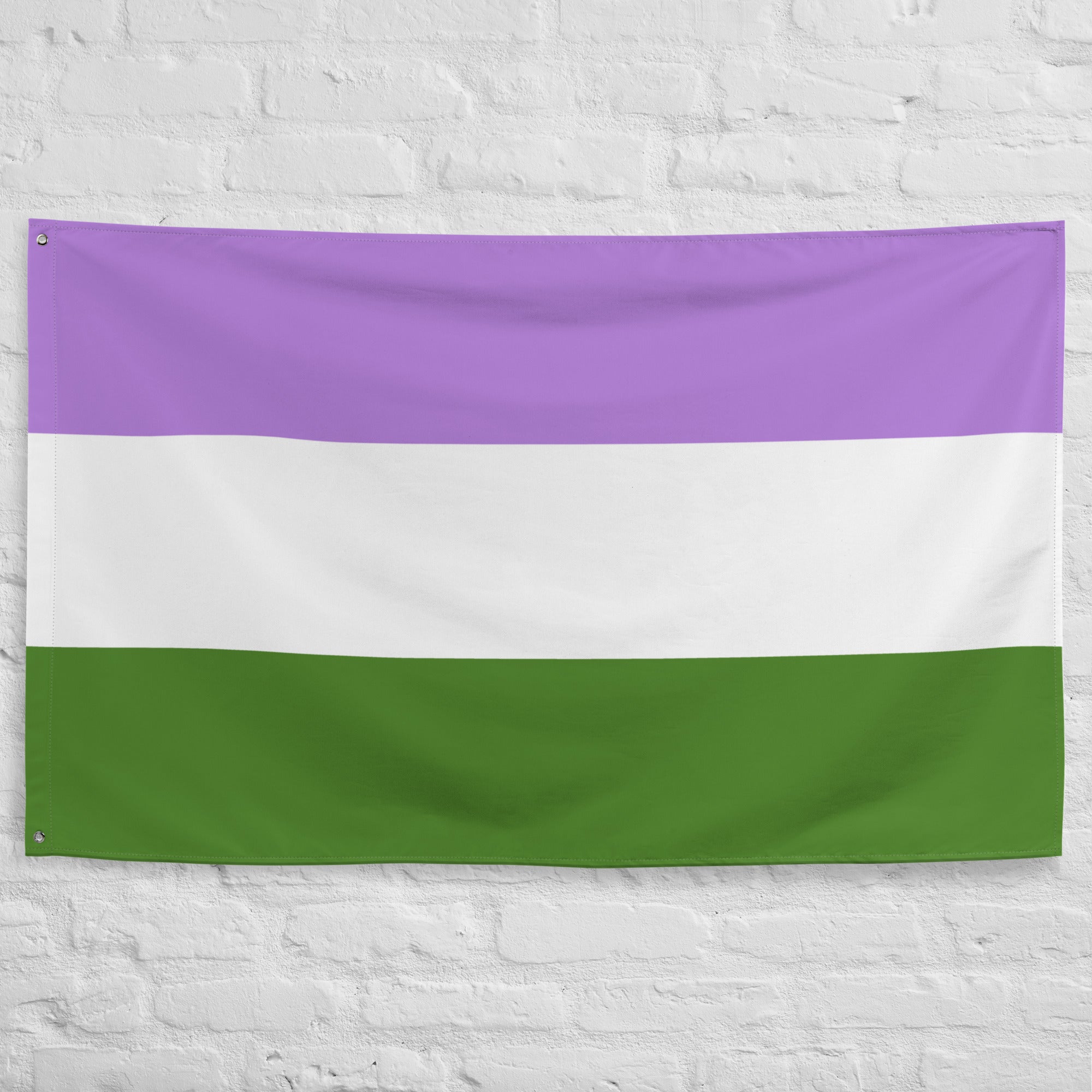 A Genderqueer Pride Flag by Pridelity, featuring three horizontal stripes of purple at the top, white in the middle, and green at the bottom, hangs proudly against a white brick wall, hinting at the vibrant offerings of a rainbow shop.