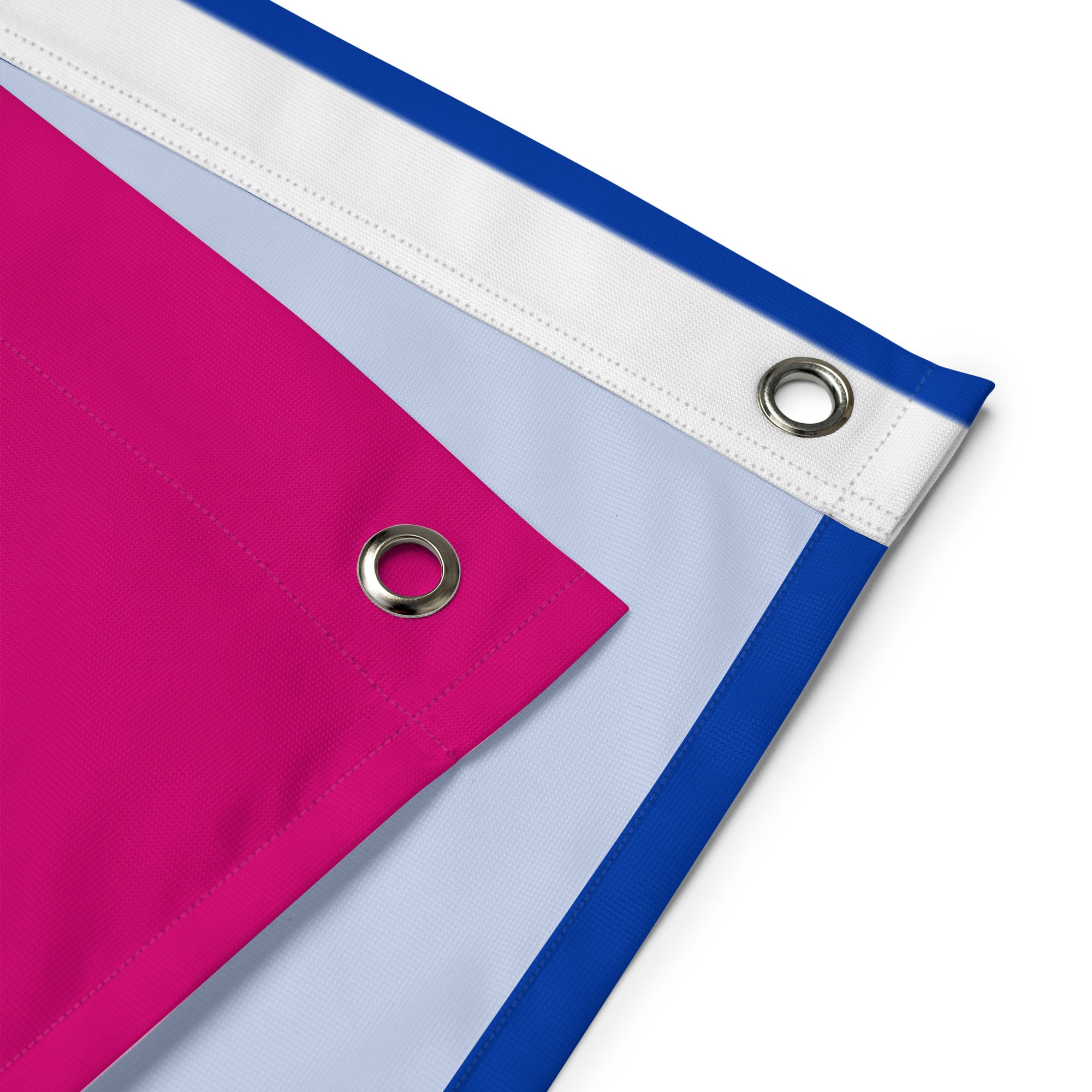 The Bisexual Pride Flag from Pridelity boasts horizontal stripes with a vibrant design: a bright pink on top, a thin purple in the middle, and a deep blue at the bottom. Displayed elegantly against a white brick wall, it embodies the spirit of Pride.