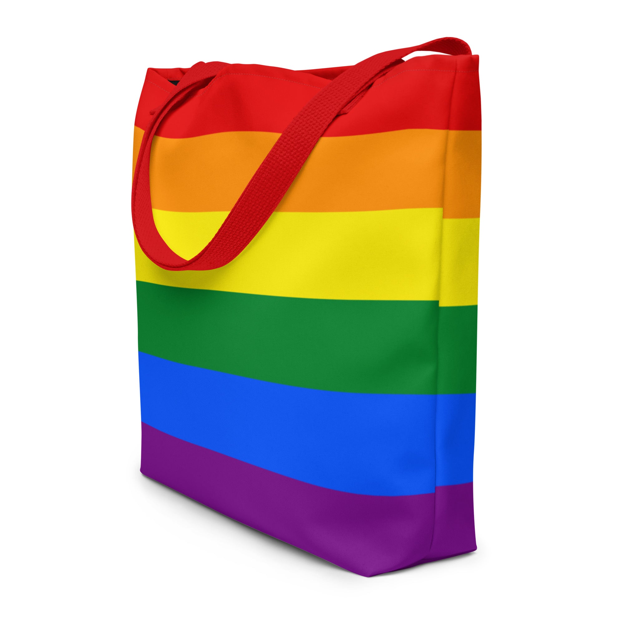 A brightly colored Pride Bag by Pridelity, featuring horizontal rainbow stripes and vibrant red handles, is perfect for your next trip to the rainbow store.